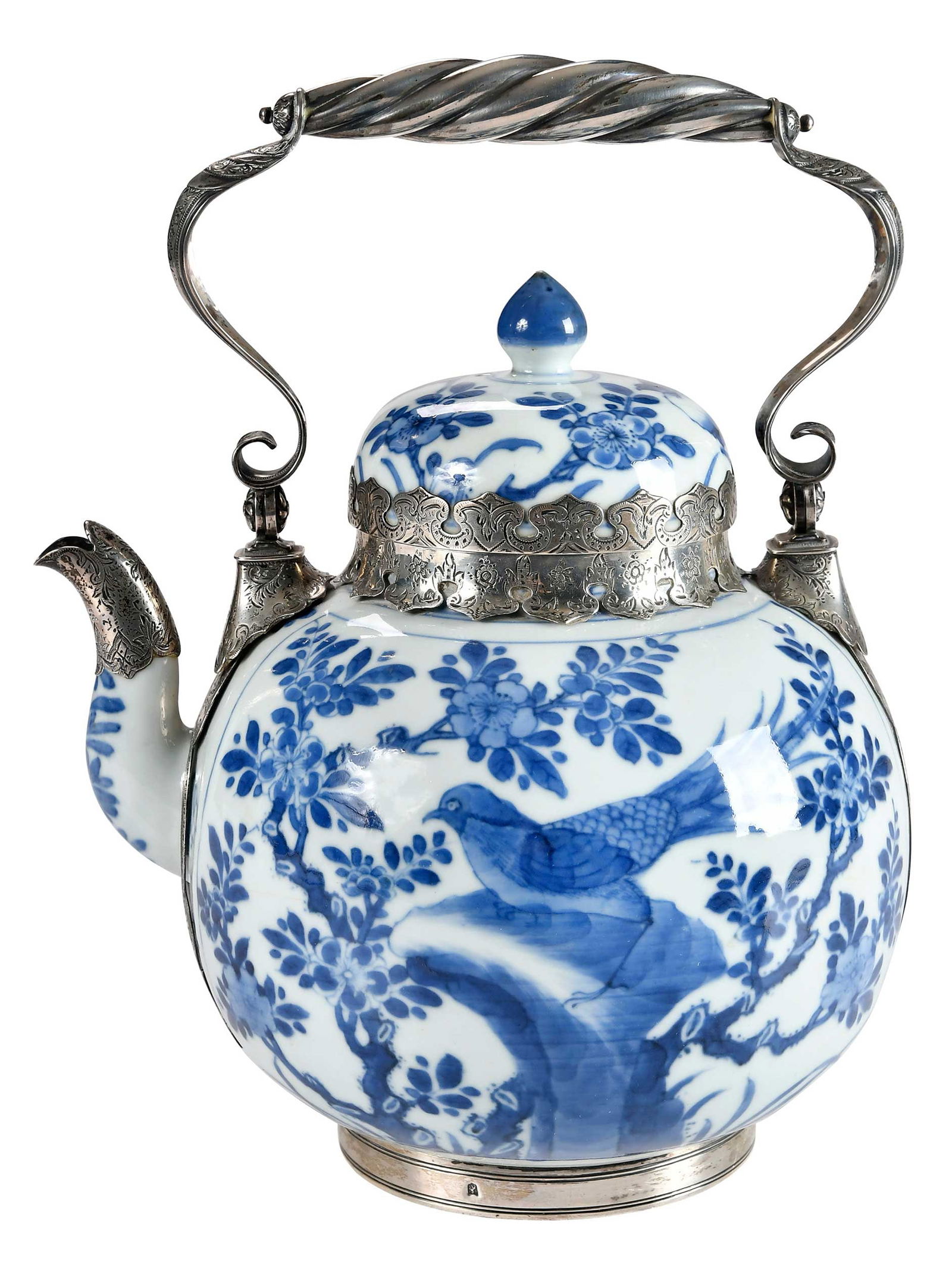 Chinese Blue and White Porcelain Tea Pot with Silver Mounts: possibly Qing dynasty, depicting a game bird amongst trees on a rocky outcropping, double ring mark to base, with later early 20th century Dutch silver mounts, 10-3/8 x 8-1/8 x 6-3/4 in. Provenance: E