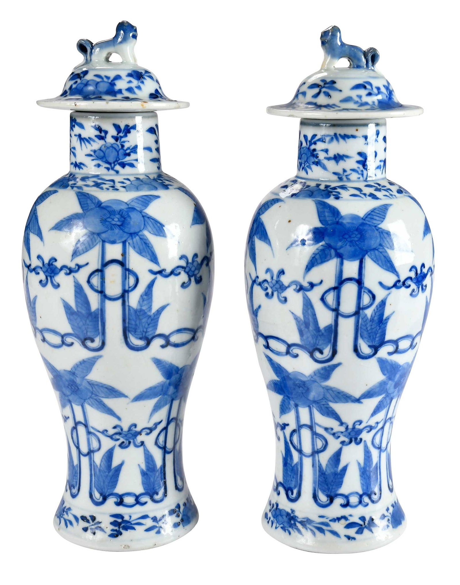 Pair of Chinese Blue and White Lidded Porcelain Urns: possibly Qing dynasty, baluster form, lids with fu lion form finials, ring mark to bases, 12-1/2 x 4-1/2 x 4-1/2 in. Provenance: Estate of Linda Sargent Thompson, Historic Sesame Lodge, North Augusta,