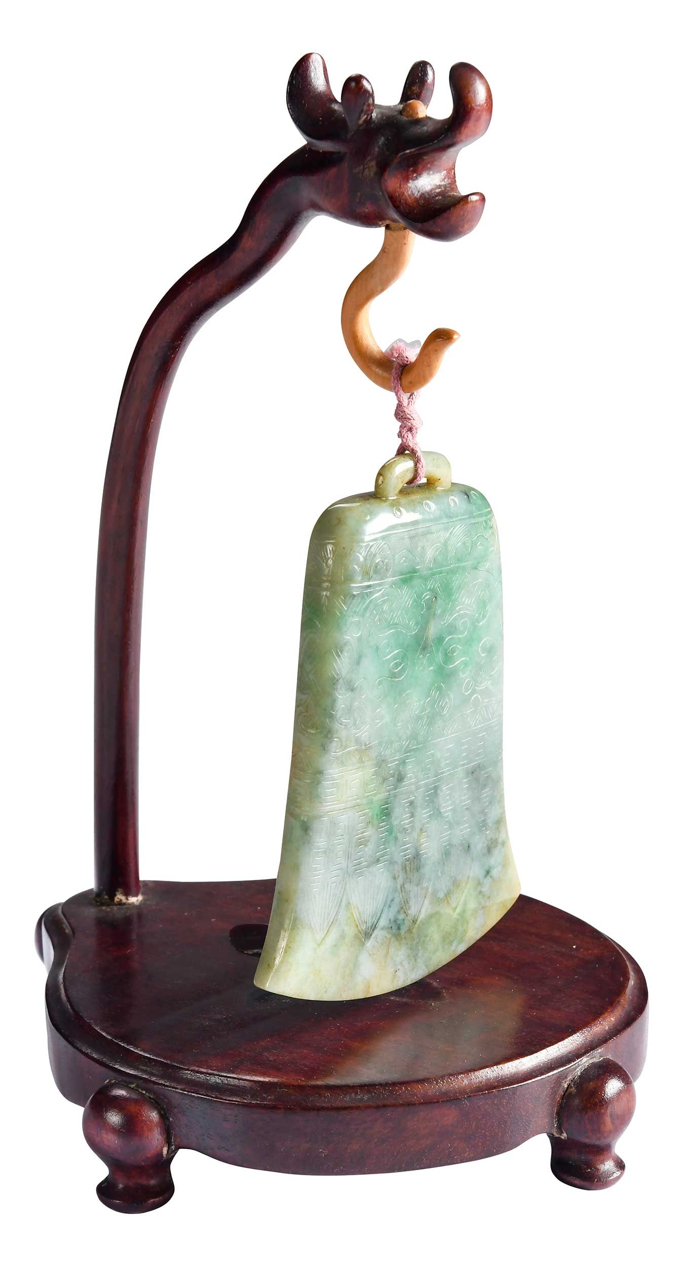 Chinese Hardstone Pendant with Hardwood Stand: pale green with celadon, russet, brown, and green apple inclusions, 4 x 3 x 3/8 in.; carved wood hanging stand, 7-7/8 x 5-3/4 x 5-1/8 in. 