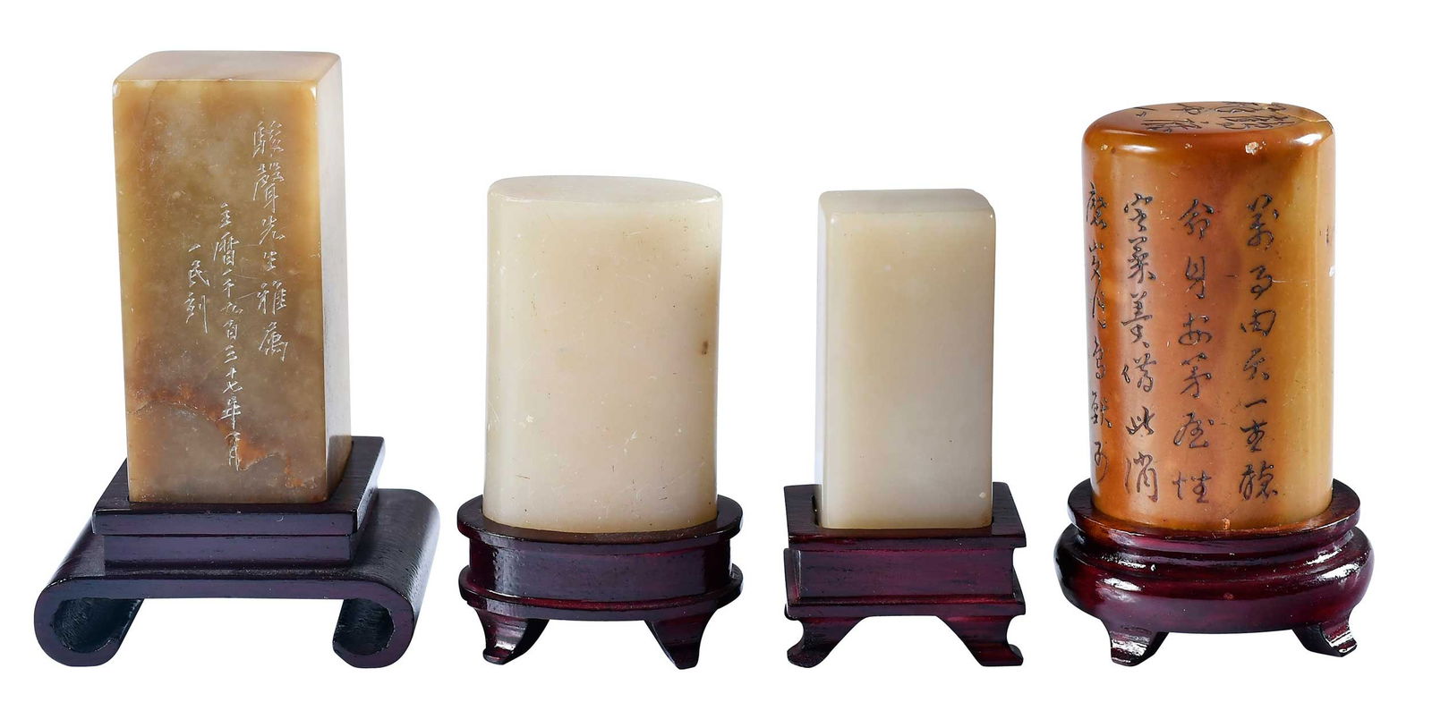 Four Chinese Carved Hardstone Seals with Stands: all with inscriptions and seal base, each with conforming stand, largest 3-1/8 x 2 x 1-1/2 in. including standProvenance: The Lifetime Collection of Ronald Elliott Hasbrouck Woodaman (1937-2025),