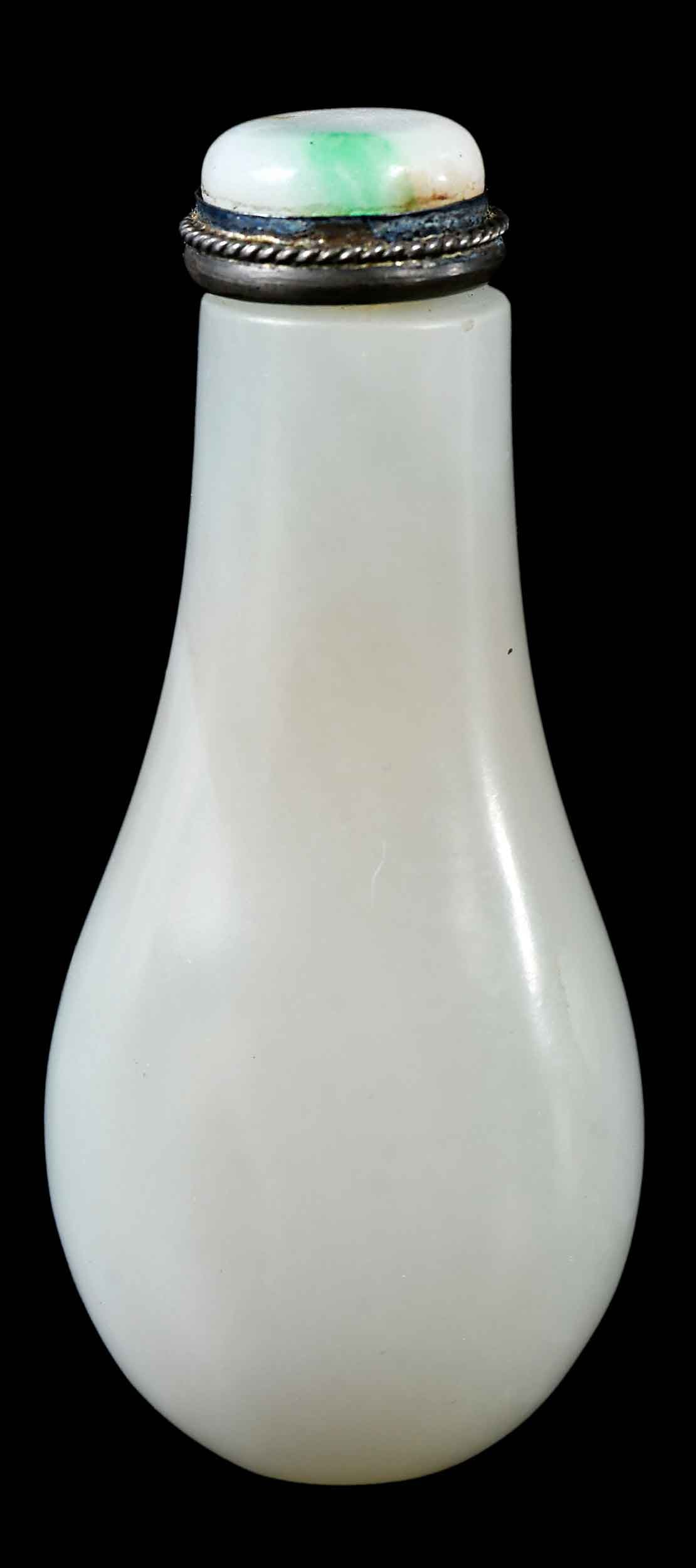 Chinese Carved White Jade Teardrop Form Snuff Bottle: well hollowed interior, jadeite cap and boon spoon, 2-3/4 x 1-1/8 x 3/4 in. Provenance: The Lifetime Collection of Ronald Elliott Hasbrouck Woodaman (1937-2025), Virginia Note: The body tested as neph