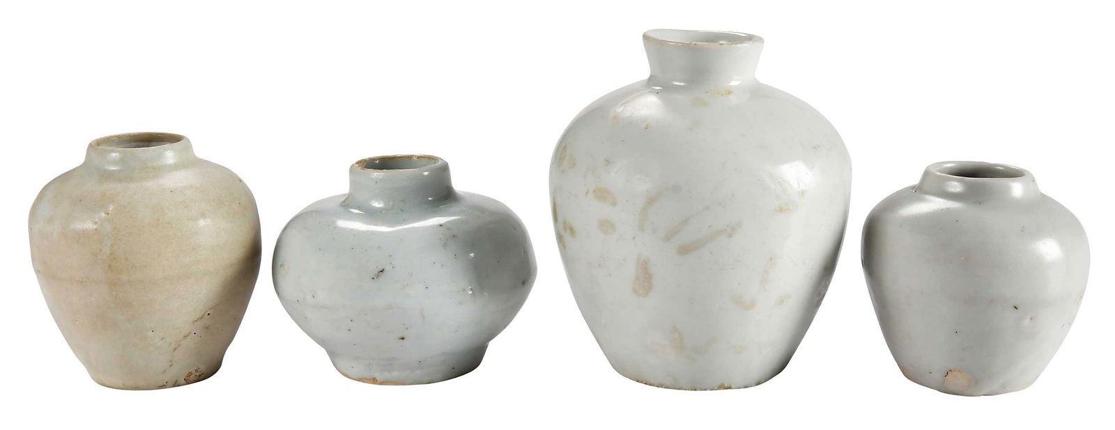 Four Chinese Pale Celadon and Light Blue Jarlets: possibly Song dynasty, of varying size, largest 3-1/2 x 3 x 3 in.Provenance: Private Virginia Collection