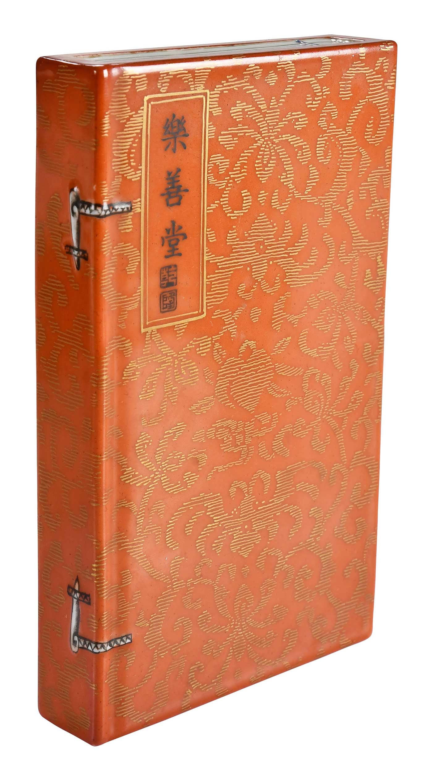 Chinese Iron Red and Gilt Book Form Scroll Weight: gilt scrolling on iron red ground, possibly related to the Lok Sin Tong charity of Hong Kong, 1 x 4 x 6-5/8 in. Note: A similar example sold at Brunk Auctions, September Premier Auction: Day 1, Septem