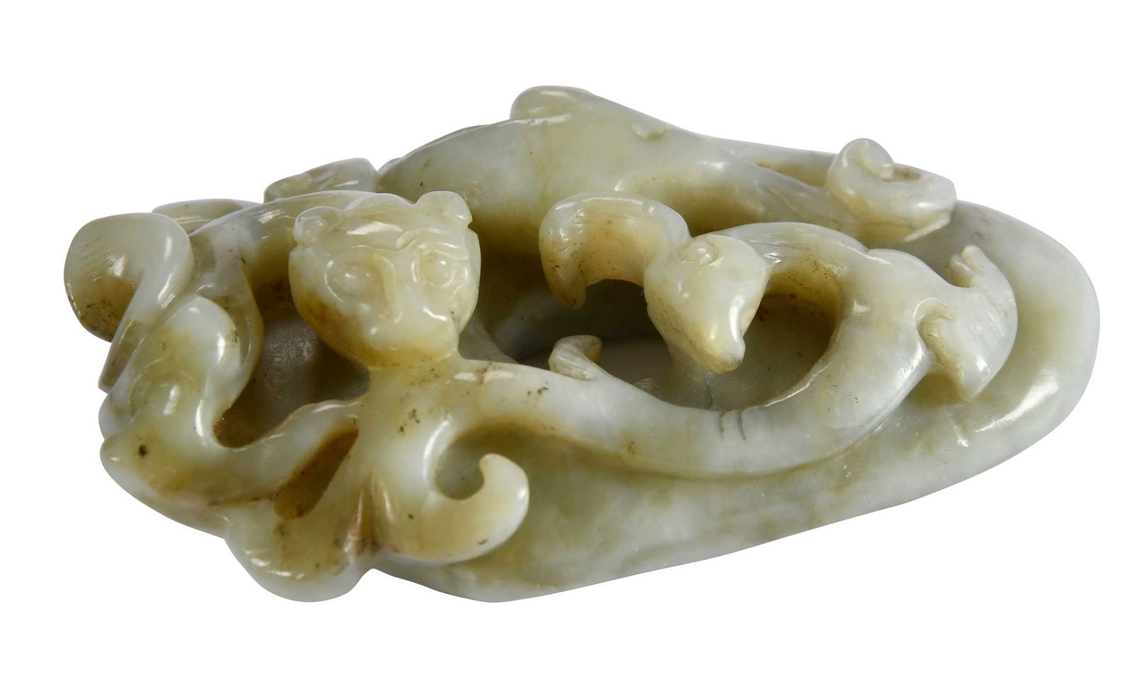 Small Chinese Carved Jade Pendant: animals on a shield form base, celadon with black inclusions, 3/4 x 1-5/8 x 2-5/8 in. Note: This item tested as jadeite on the Presidium Gem Tester II. 