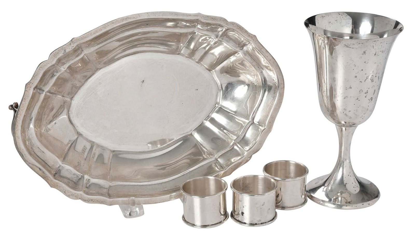 Five Sterling Table Items: American, 20th century, including Gorham goblet, "272"; 6-3/4 in.; three Towle napkin rings; two handle entree lid, 10-1/4 in., no monograms, 19.09 oz. T.Provenance: Private Collection, South Carolina