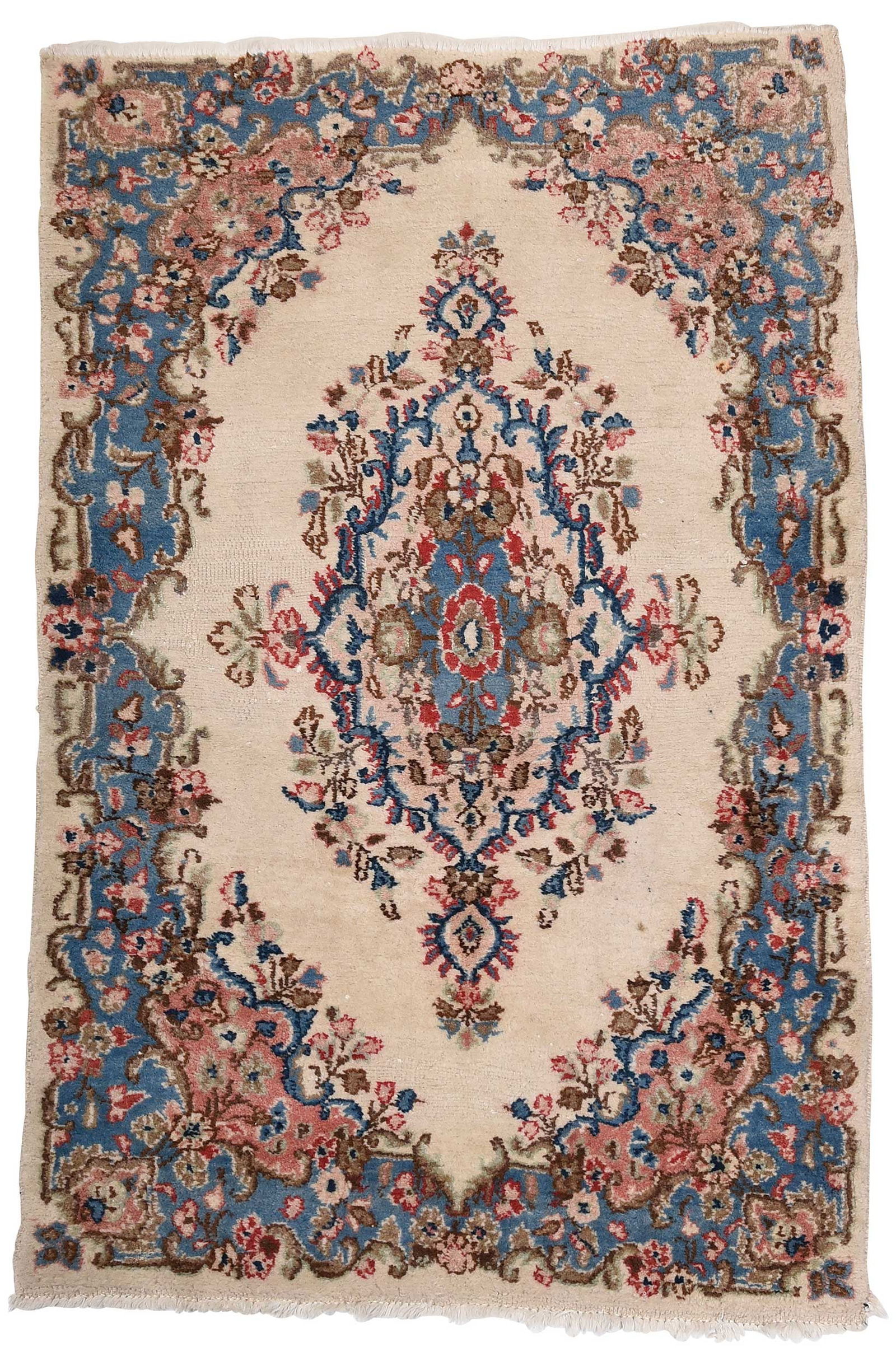 Kerman Rug: 20th century, white field, central floral medallion, 5 ft. 5 in. x 3 ft. 7 in.Provenance: Private Collection, Pittsboro, North Carolina