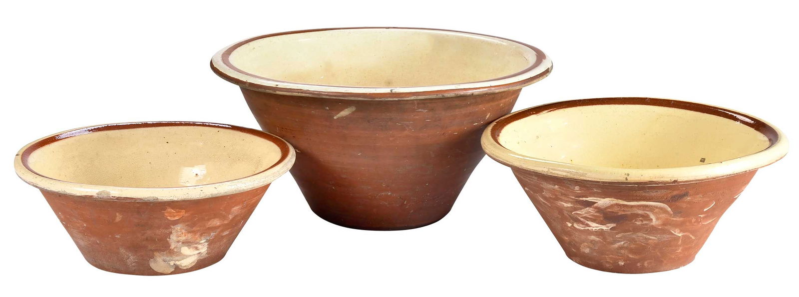 Three English Cream Glazed Earthenware Pippin Bowls: 19th century, each of tapered form with cream glazed interior, various sizes, largest 8-1/5 x 17 x 17 in. 