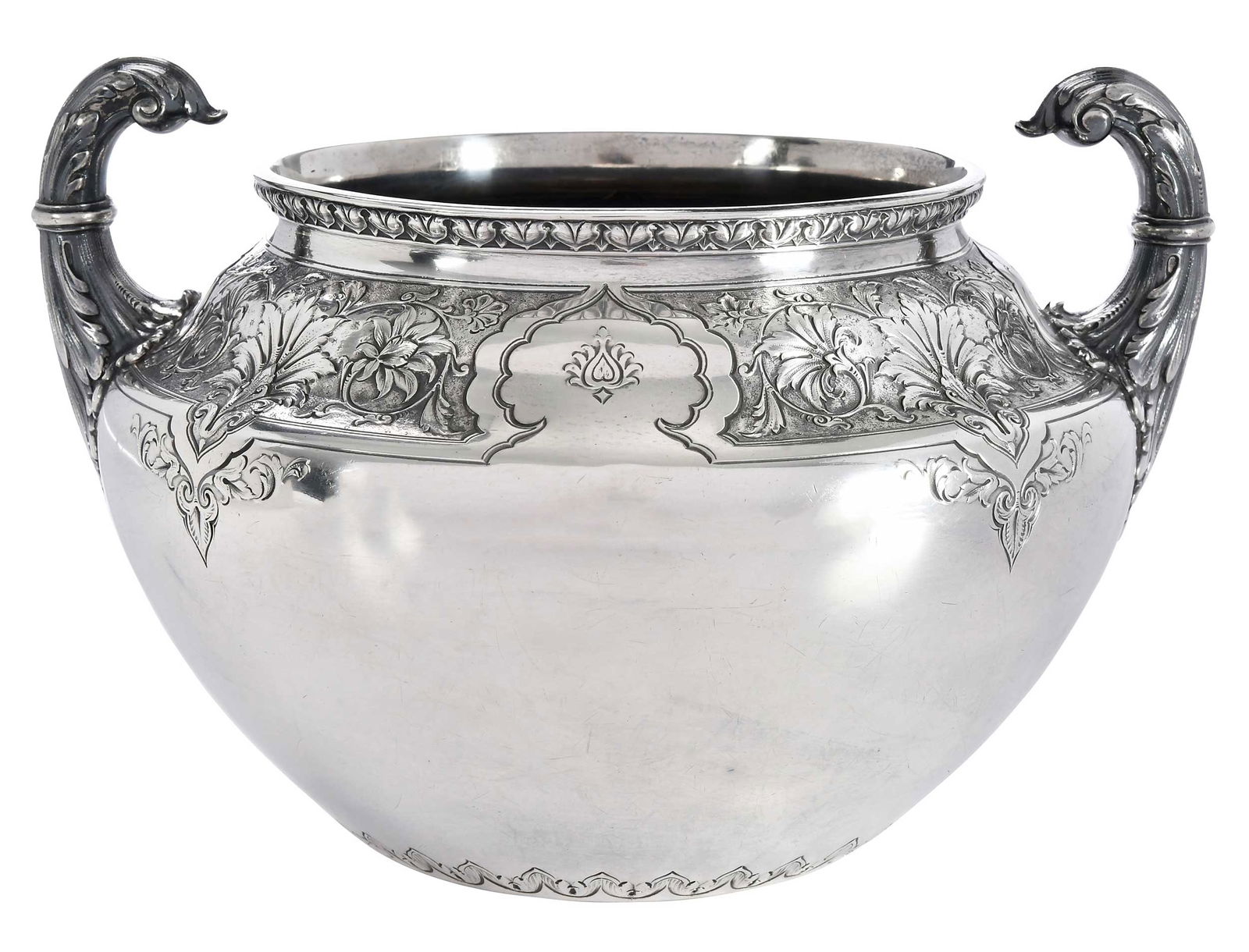 Cartier Sterling Two Handle Bowl: late 19th/early 20th century, round with scroll handles, arabesque decoration, no monogram, marks for maker Lebkuecher & Co. and retailer Cartier, 39.48 oz. T., 6-3/4 x 10 x 8-3/4 in. Provenance: Irvi