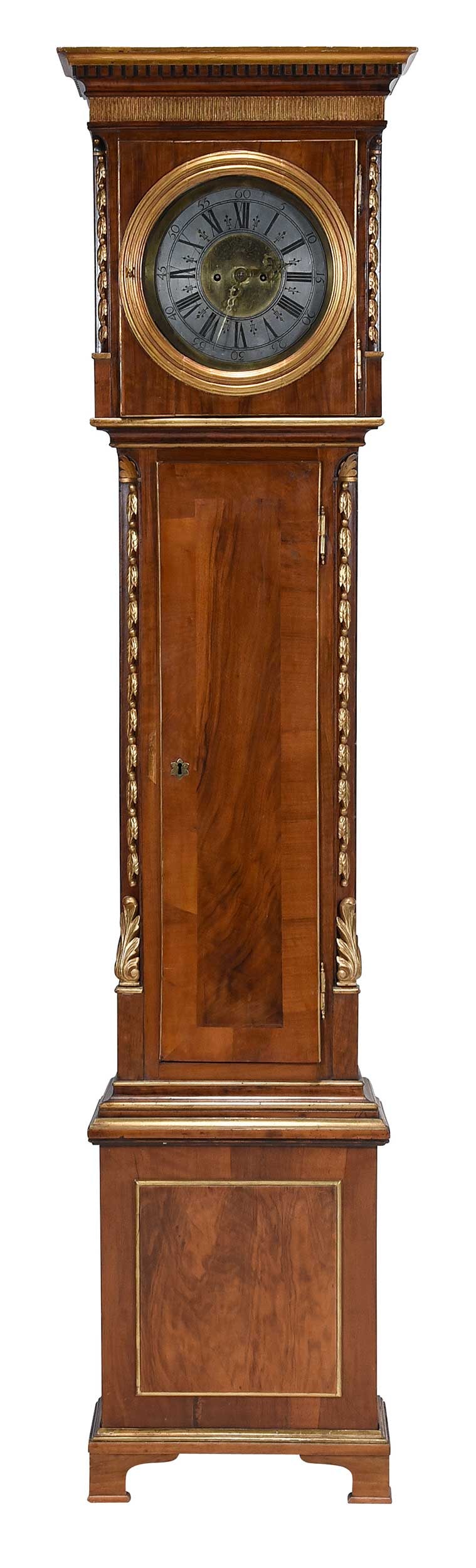 Neoclassical Carved and Parcel Gilt Tall Case Clock: Continental, possibly Germany or Austria, first half 19th century, engraved and silvered brass dial, bonnet and crown carved with foliate pendant husks, parcel gilt trim throughout, two weights and