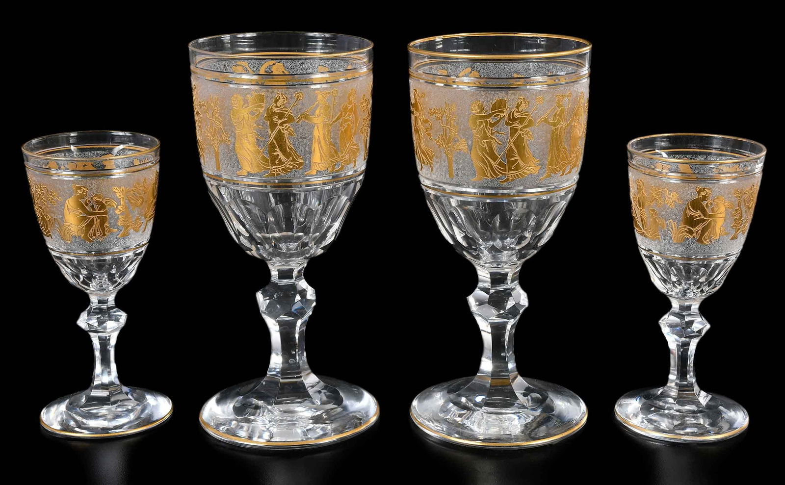 Set of 29 Val St. Lambert Danse de Flore Clear and Gilt Glass Stems: Belgian, 20th century, fourteen 6-3/4 in. stems, fifteen 5 in. stems/cordialsProvenance: Estate of Lamar John Ryan Cecil, Lynchburg, Virginia