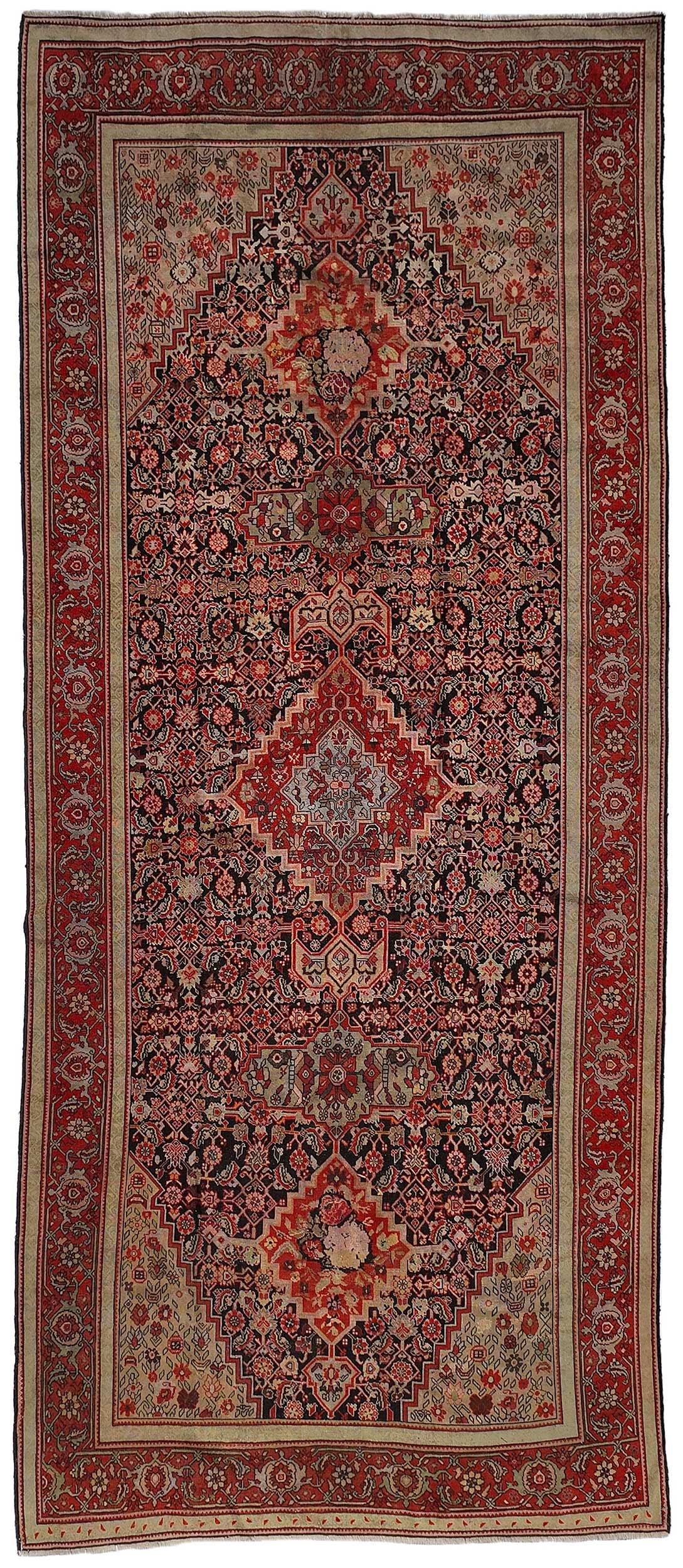 Bidjar Runner: three medallions on dark blue ground, red main border, 16 ft. x 7 ft. 3 in.Provenance: Private Collection, Greenville, South Carolina