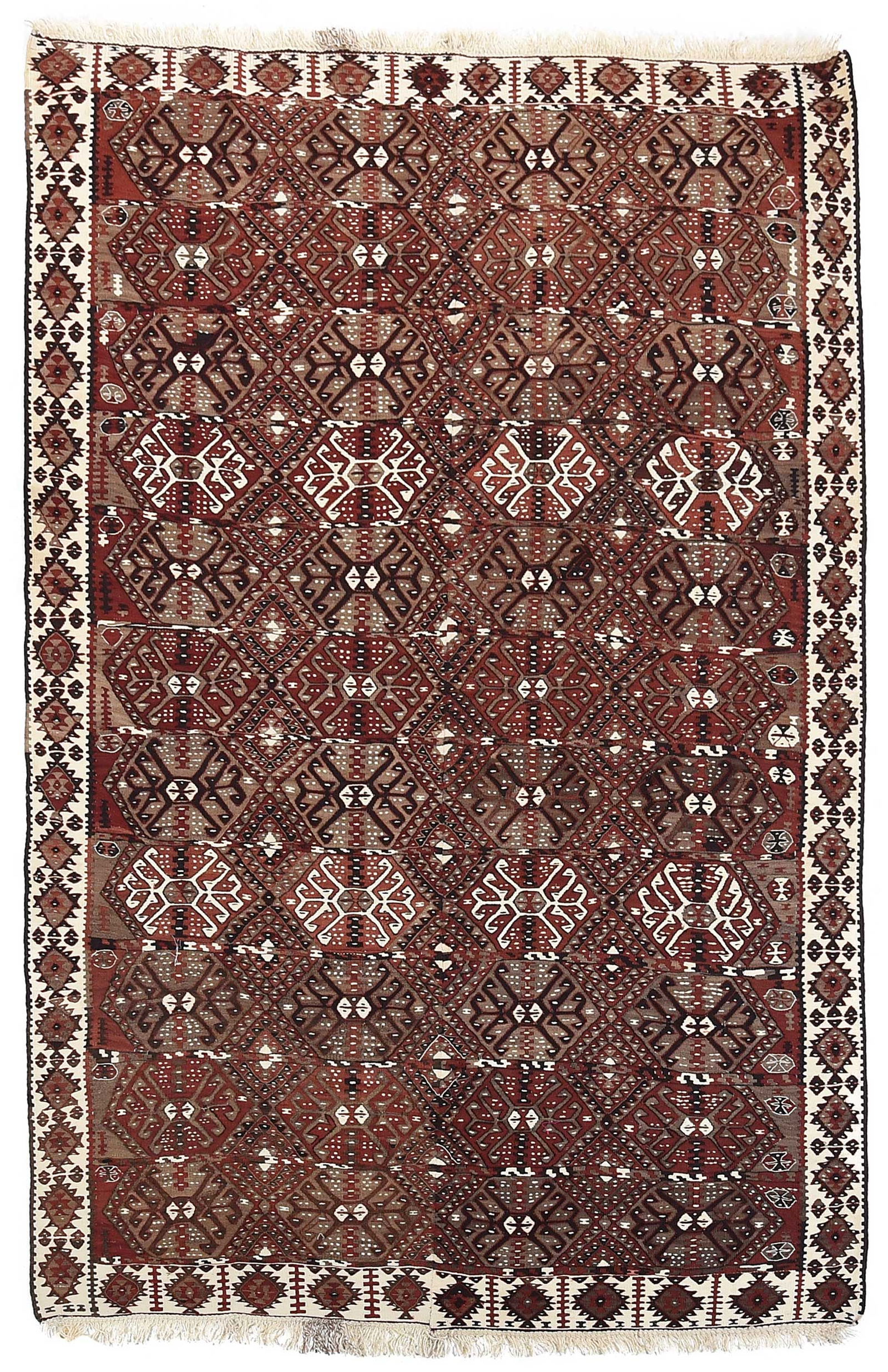 Turkish Van Kilim: mid to late 20th century, hexagonal medallions on red ground, white main border, 8 ft. 6 in. x 5 ft. 7 in. 