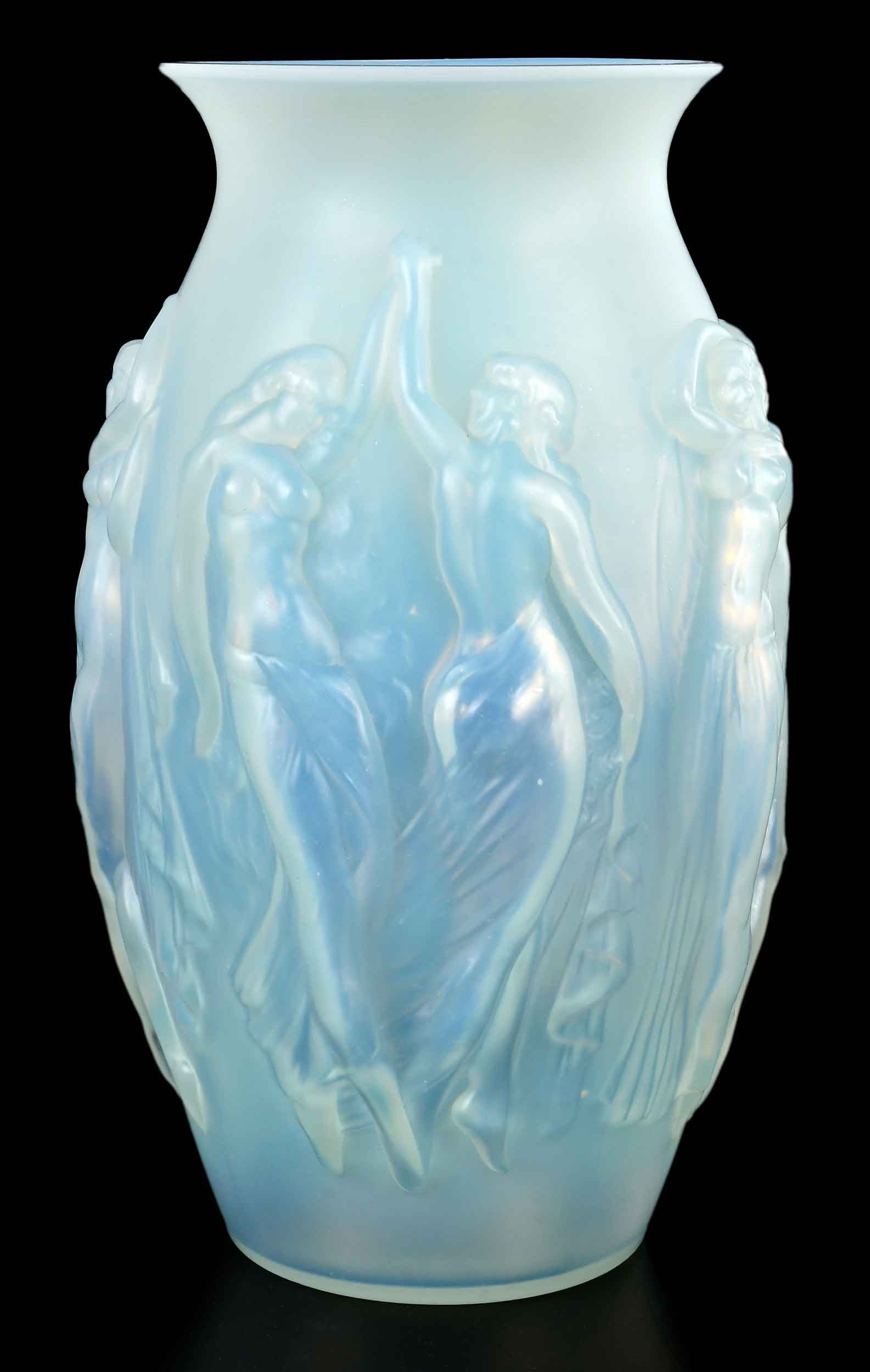 Sabino Opalescent Vase La Danse Glass Vase: French, circa 1930, base inscribed "Sabino/France", with impressed decoration of dancing maidens, accompanied by original booklet, 14 x 8-1/2 x 8-1/2 in. Provenance: Private Collection, Asheville, Nor