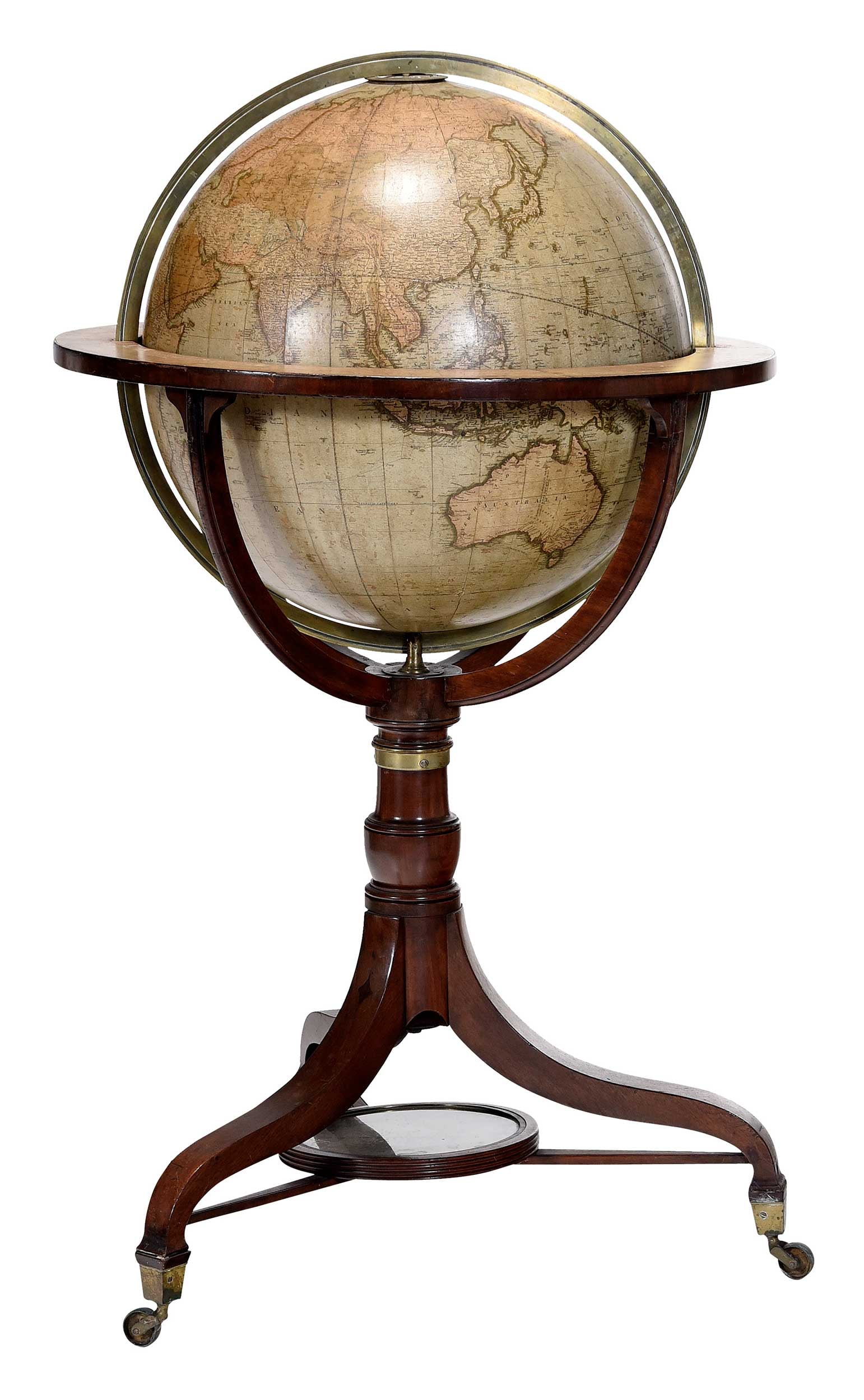 J&W Cary Regency Mahogany Terrestrial Library Globe: British, circa 1828, 21 in. diameter terrestrial globe with editions to 1828, on inlaid mahogany tripod stand with original compass to base, 48 x 27-1/2 x 27-1/2 in. Provenance: Estate of Linda Sargen