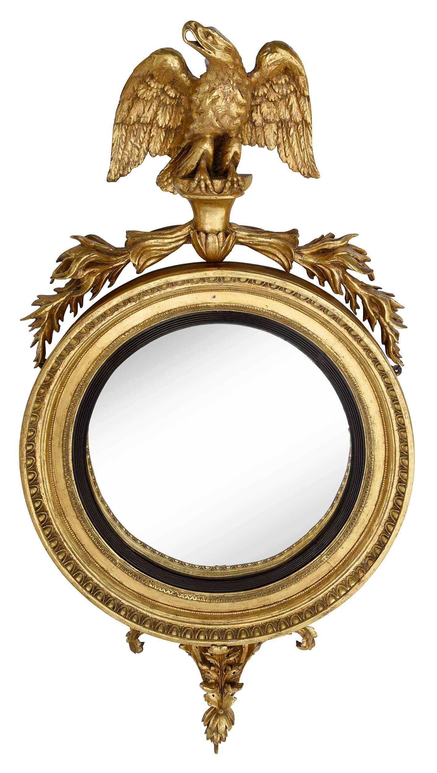 Rare Regency Carved Giltwood Convex Mirror: Thomas Fentham label to reverse, London, 19th century, crowned with eagle, fluted ebonized trim around mirror, 55-1/2 x 29 x 10 in.Provenance: Property from a Private Collection, Vero Beach, Florida