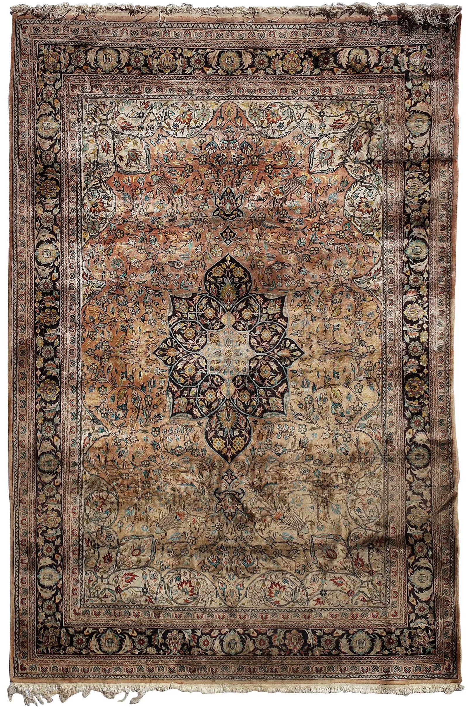 Persian Silk Rug: 20th century, central medallion on orange ground, black main border8 ft. 3 in. x 5 ft. 7 in. Provenance: Private Collection, Greenville, South Carolina