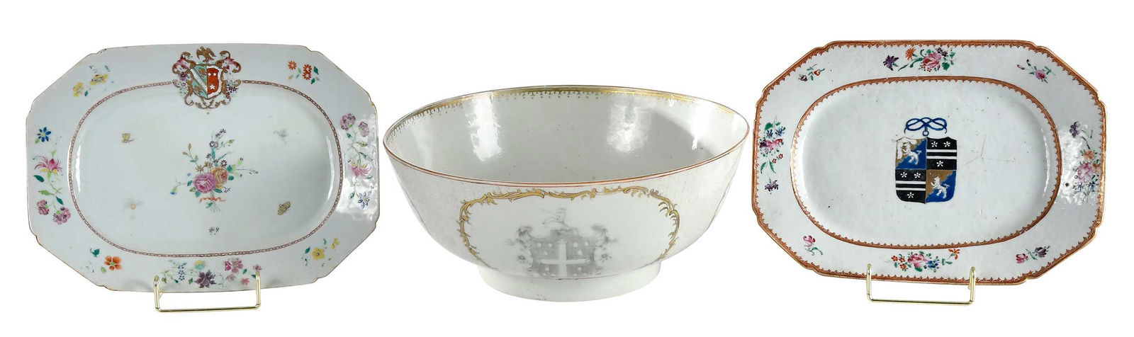 Two Chinese Export Armorial Octagonal Serving Dishes and a Punch Bowl: circa 1765, octagonal dish centered with arms of Stuckey quartering Bartlett; circa 1760, octagonal dish centered with arms of Justice impaling Barbour; circa 1755, punch bowl with arms of Norris