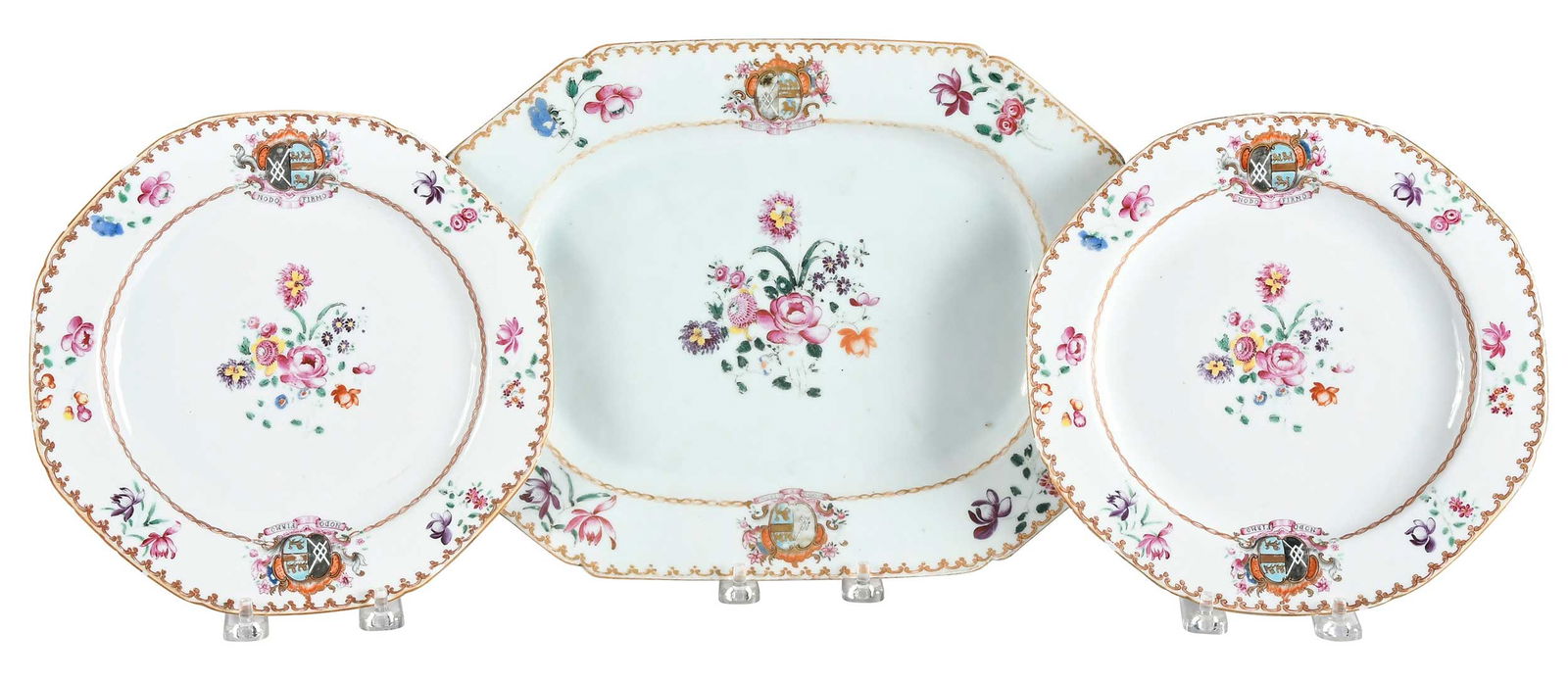 Three Pieces of Chinese Armorial Export Porcelain, Harrington impaling Rockley: circa 1755, floral sprays and gilt spearhead and chain centering a floral spray, the arms of Harrington impaling Rockley and motto "Nodo Firmo" in the border, largest 1 x 9-7/8 x 13 in.Provenance: