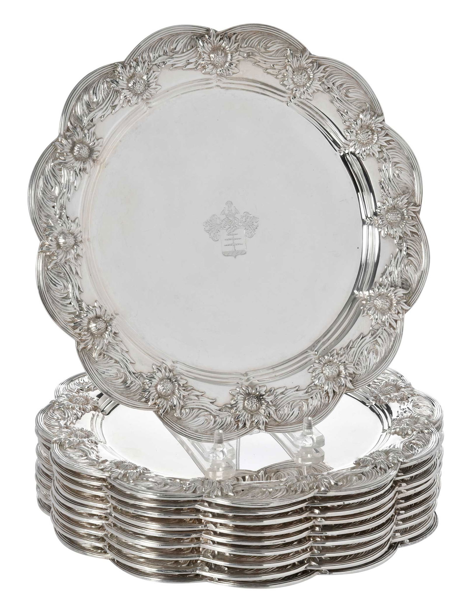 Set of Ten Tiffany Chrysanthemum Sterling Plates: American, 1907-1947, round scalloped border with chrysanthemums, central crest, all with marks for Tiffany & Co., "7289...210", 193.29 oz. T., 10 in.Provenance: Private Oregon Collection
