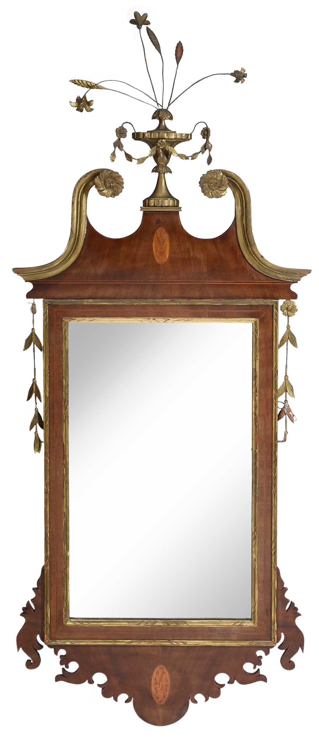 American Federal Inlaid Mahogany and Parcel Gilt Mirror: probably New York, early 19th century, streamers to sides, urn issuing flowers and wheat finial, 57 x 22 x 2-1/2 in. Provenance: Property from a Private Collection, Vero Beach, Florida