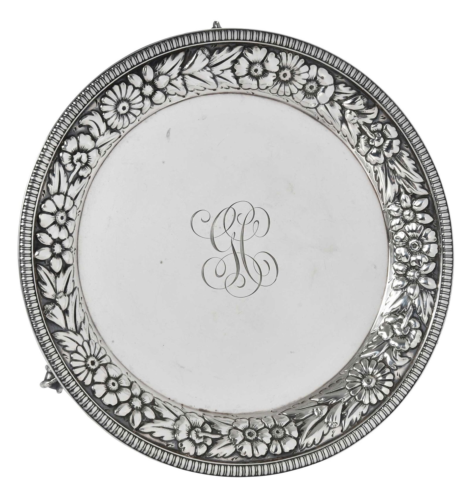 Gorham Sterling Footed Salver with Repousse Border: American, 1890, round with floral repousse border, three ball and claw feet, monogram, marks for Gorham, 10.16 oz. T., 1 x 8-1/4 in.Provenance: Estate of Lamar John Ryan Cecil, Lynchburg, Virginia