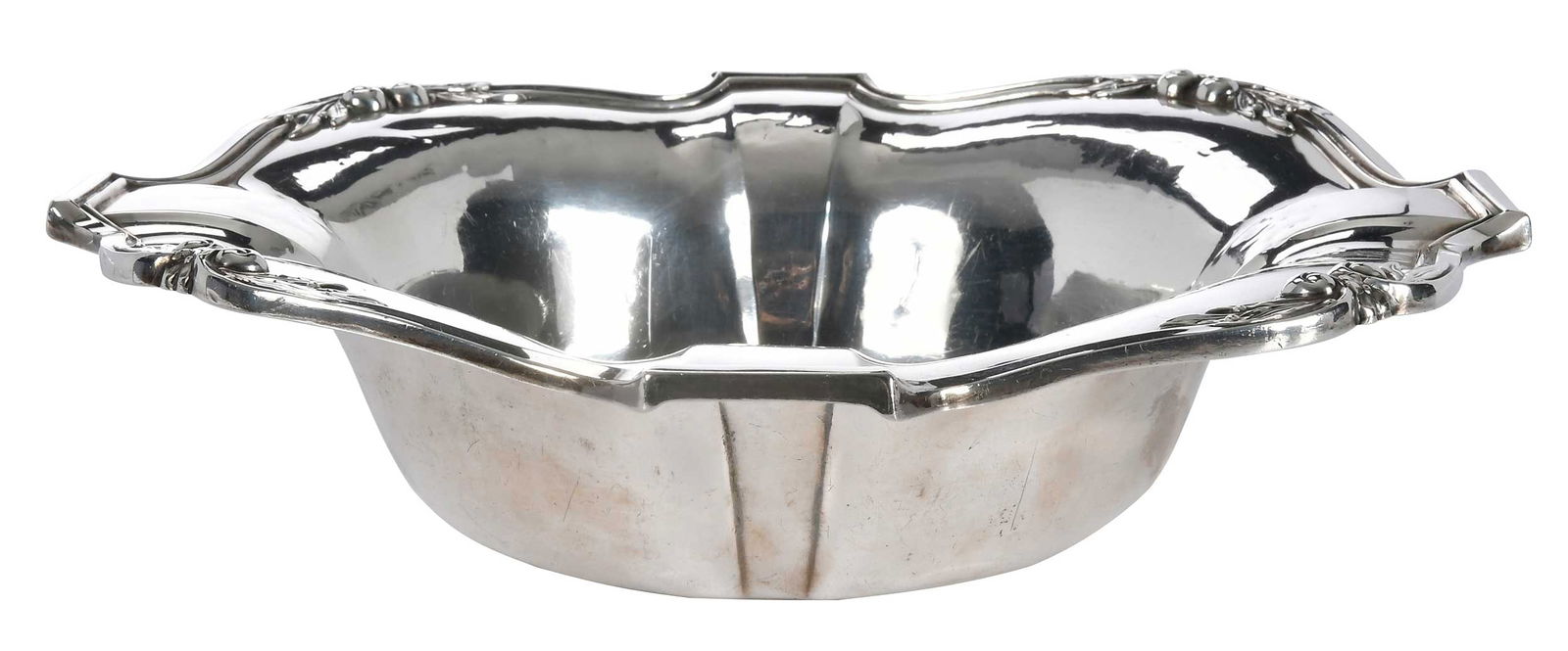Meriden Sterling Bowl: American, shaped border with scroll and foliate decoration, monogram, marks for Meriden, 16.01 oz. T., 3 x 11-1/2 in.Provenance: Estate of Lamar John Ryan Cecil, Lynchburg, Virginia