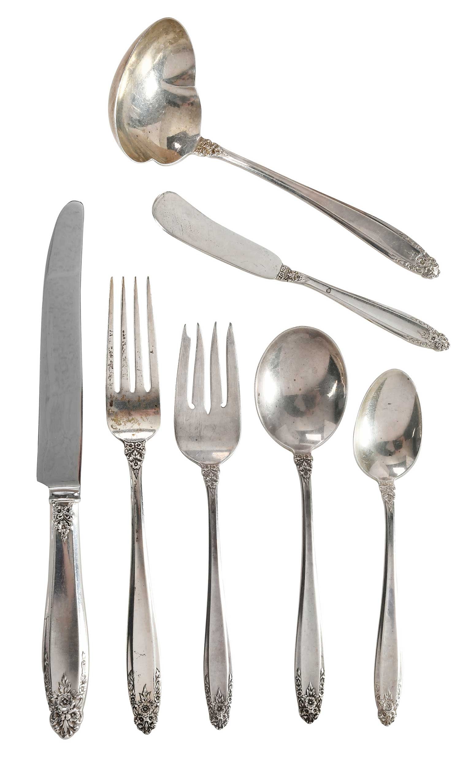 Prelude International Sterling Flatware, 65 pieces: American, 20th century including ten hollow handle knives; ten forks; ten salad forks twelve teaspoons; eleven round soup spoons; ten solid handle spreaders; serving spoon; ladle, no monograms, all wi