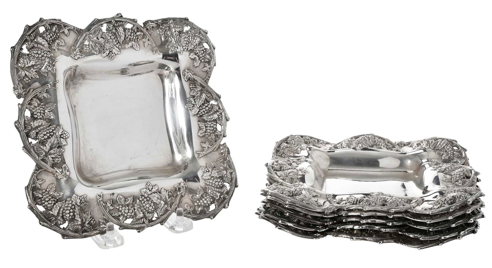 Set of Six Sterling Plates with Grape and Vine Decoration: American, 20th century, square with open work grape and vine decoration, marks for Woodside, 37.87 oz. T., 6-1/2 x 6-1/2 in. Provenance: Estate of Linda Sargent Thompson, Historic Sesame Lodge, North