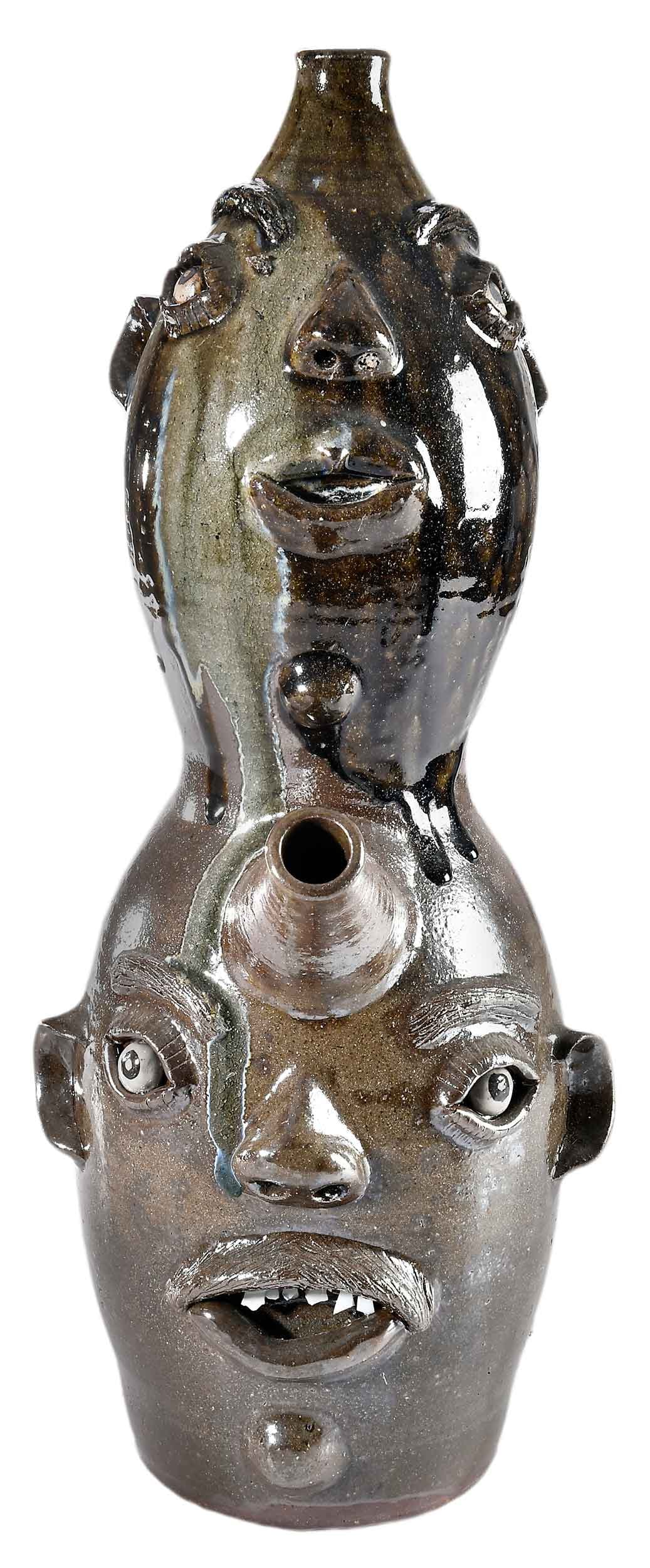 Large South Carolina Billy Henson Triple Face Monkey Jug: (Spartanburg County, SC, 1941-2001) double gourd form, brown and tan underglaze, runny dark green alkaline over glaze to top jug with large creamy green melt runs down faces and back of jug, applied