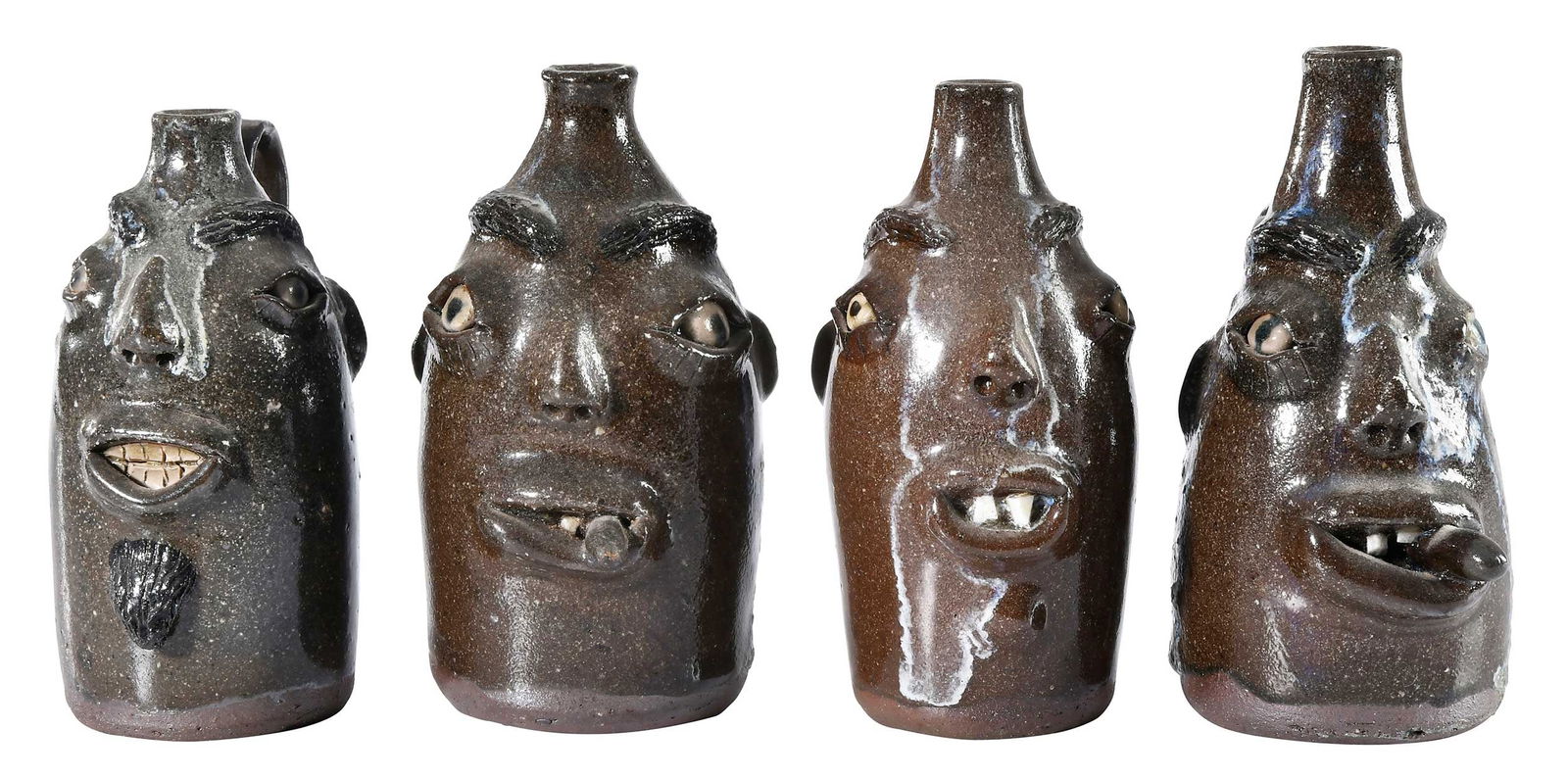 Four Small Billy Henson South Carolina Stoneware Face Jugs: (Spartanburg County, SC, 1941-2001) all with brownish alkaline glazes and one with grayish green glaze runs, all having melt runs with bluish white highlights, applied facial features, broken china