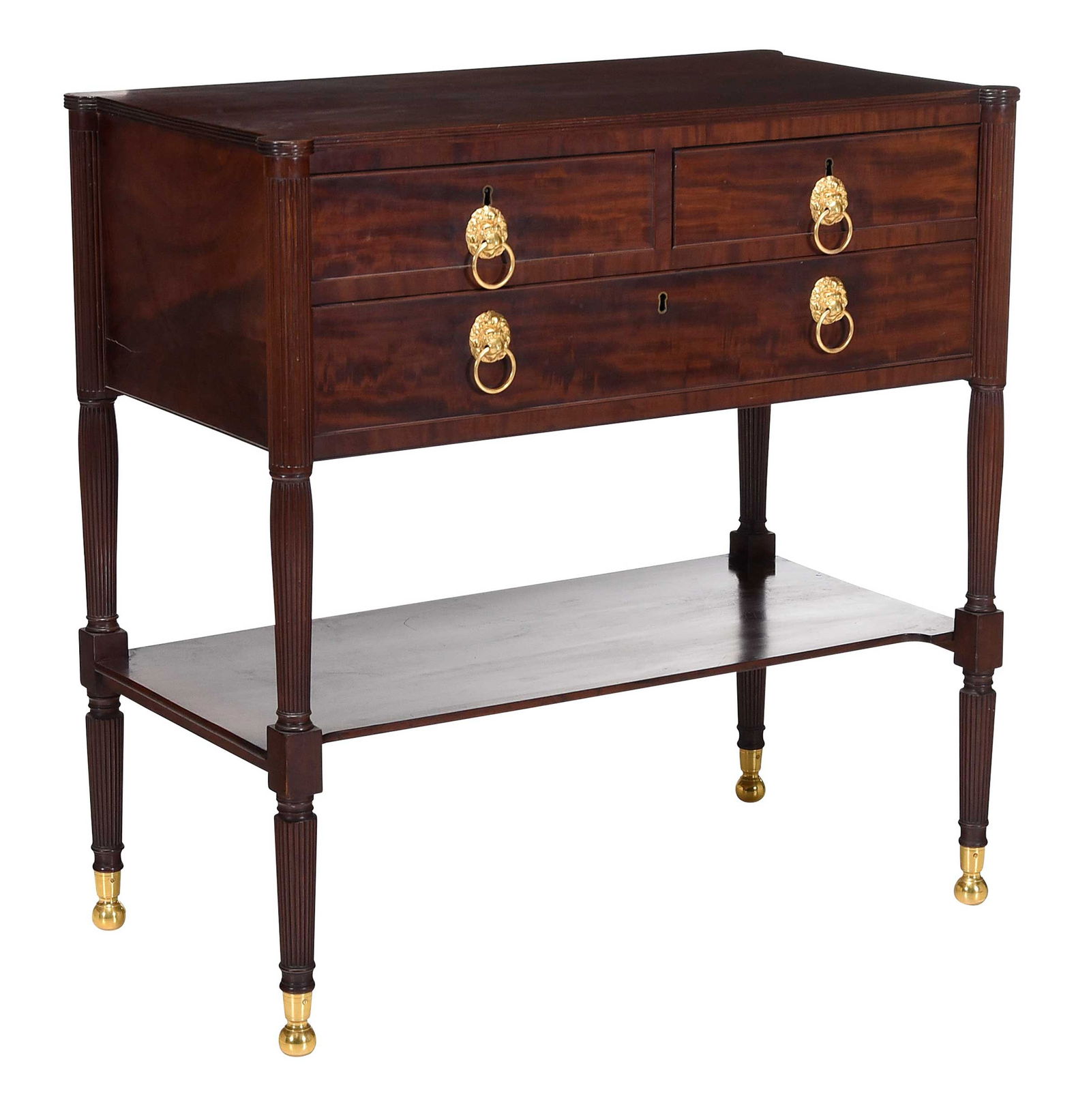 New York Classical Figured Mahogany Dressing Table: in the manner of Duncan Phyfe, circa 1815, finely constructed, gilt brass lion mask pulls and brass feet, poplar secondary wood, one drawer with partially legible inscription "...Ridgefield/Hyde