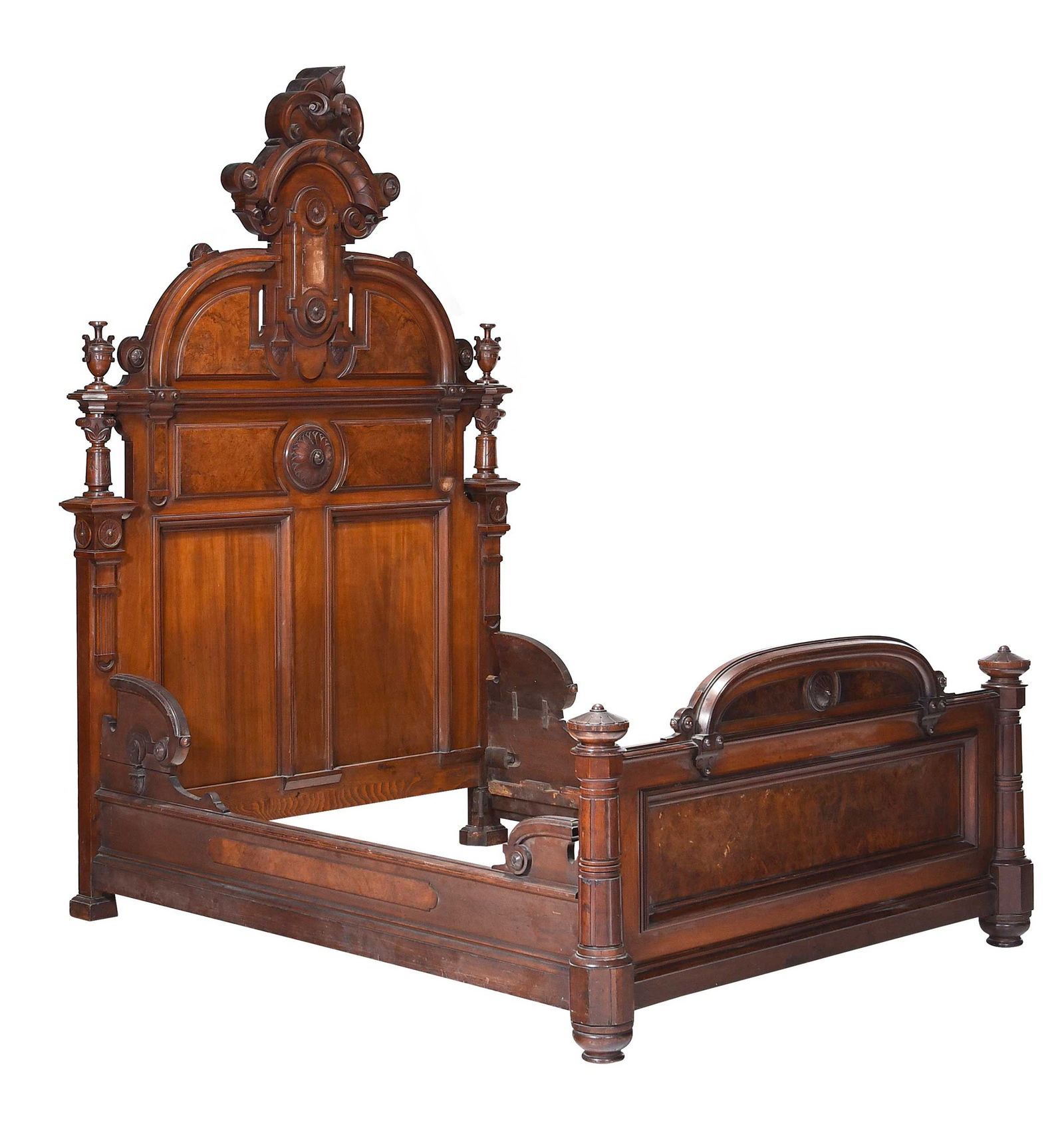 Renaissance Revival Carved and Figured Walnut Bed, Thomas Brooks Attributed: New York, circa 1875, bold carvings throughout including large crest to headboard, highly figured burl panels, unsigned, 99-1/2 x 66 x 85-1/2 in. Provenance: Gift from Eleanor Curnow, September 1945;