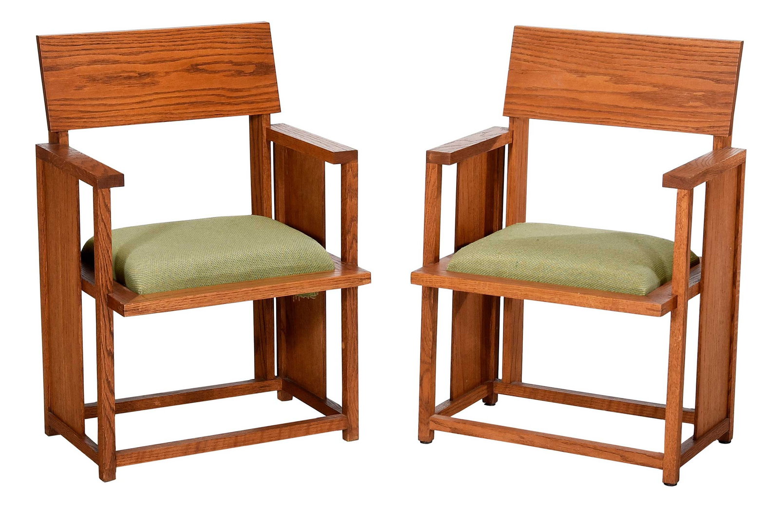 Pair of Frank Lloyd Wright Oak Armchairs, Howard Anthony House: mid 20th century, oak frames, green upholstered seats, 32-1/2 x 21-3/4 x 18 in. Provenance: Scott Elliott, Howard Anthony House, Benton Harbor, Michigan, 2003; Private Collection Note: This form is a