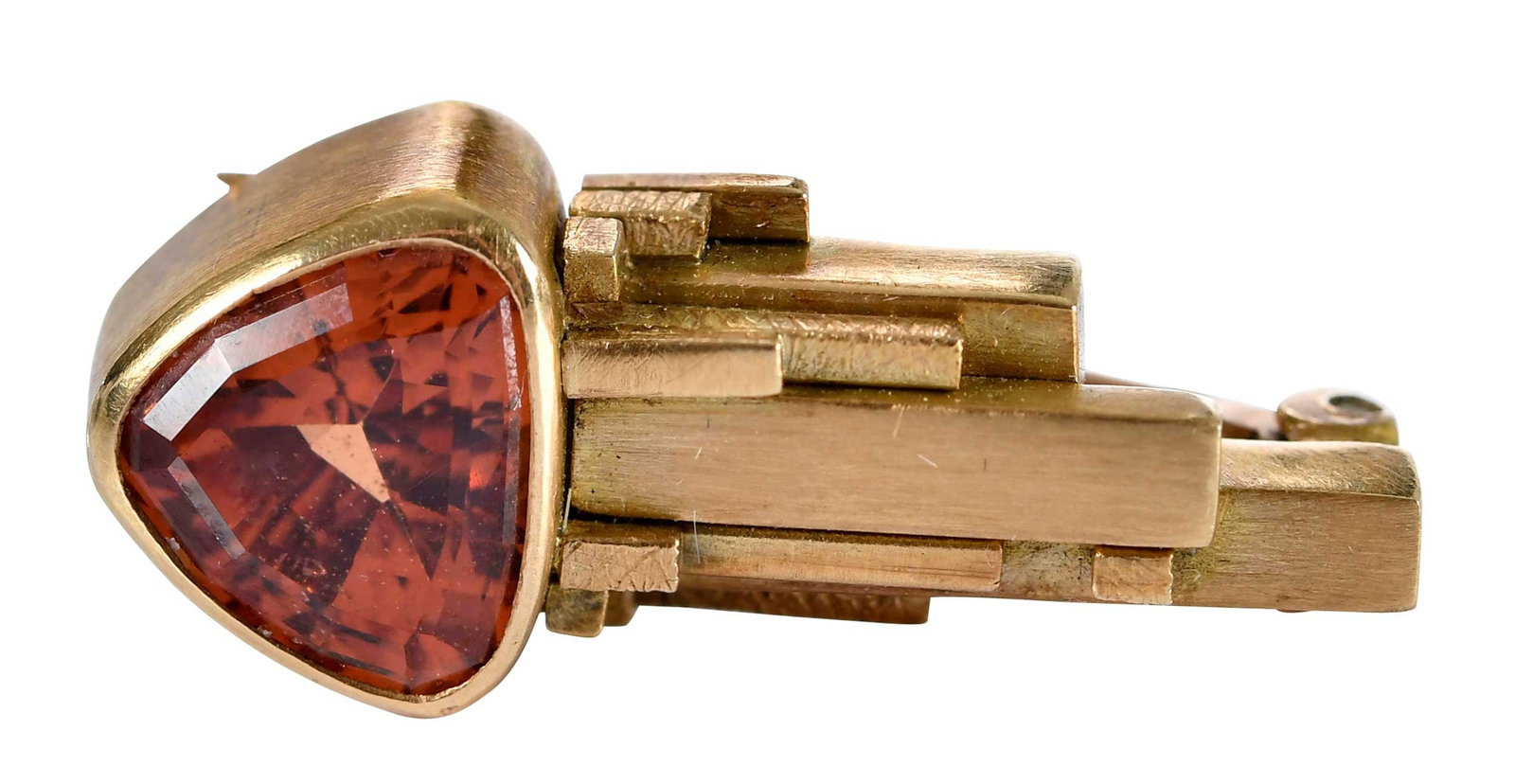 18kt. Trillion Faceted Toumaline Geometric Brooch: circa 1982, trillion faceted tourmaline, approx. 1.50ct., signed LAF, marked "18KT, 82", yellow gold, 22.5mm length, 9.5mm at widest area, 5.1 gProvenance: Private CollectionNote: Accompanied by