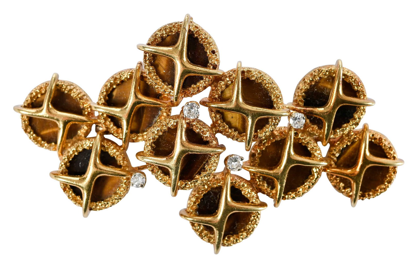 22kt. MCM Style Tiger's Eye and Diamond Brooch: 10 circular cut tiger's eye tablets, approx. 11.5mm diameter, four round faceted cut diamonds, approx. 0.25ctw., not marked, tests 22kt. yellow gold, 2-5/8 in. length, 28.3 gProvenance: Private