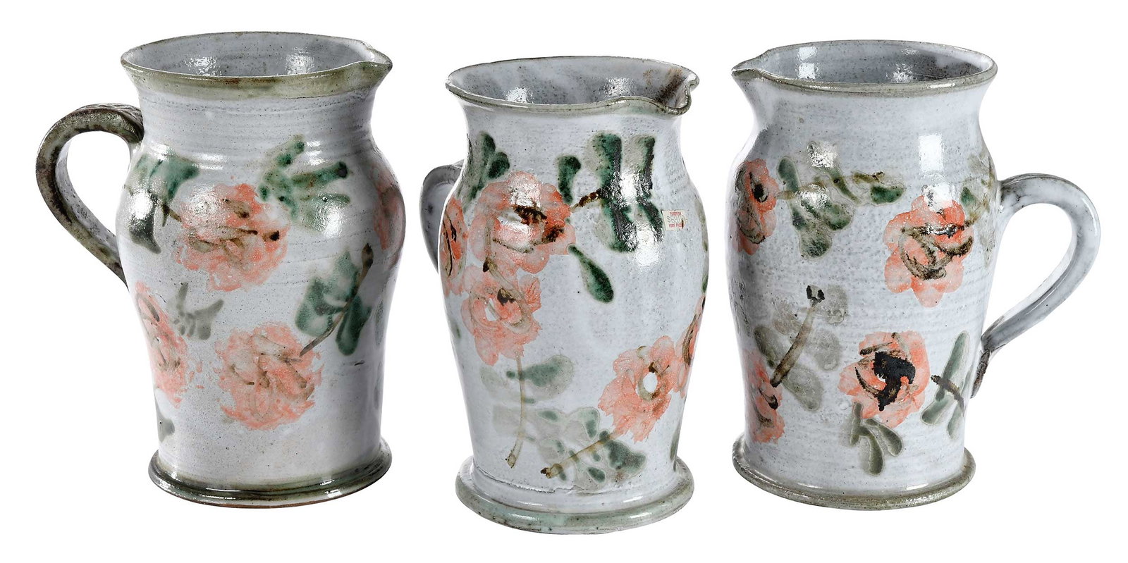 Three Albert Thiry Pink Wild Rose Pottery Country Pitchers: (French, 1923-2009) each signed "Thiry" on base, one with incised foliate decorated handle, each approximately 10-1/2 x 9-3/4 x 7-1/4 in. Provenance: Private Collection