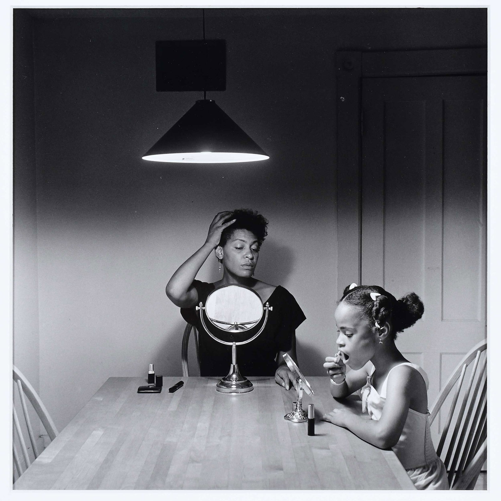 Carrie Mae Weems: (New York/Oregon, born 1954)Untitled (Woman and daughter with Makeup), 1990/2010, from the "Kitchen Table Series", signed and dated verso "Carrie M Weems. 2010," and editioned 75/100, gelatin silver