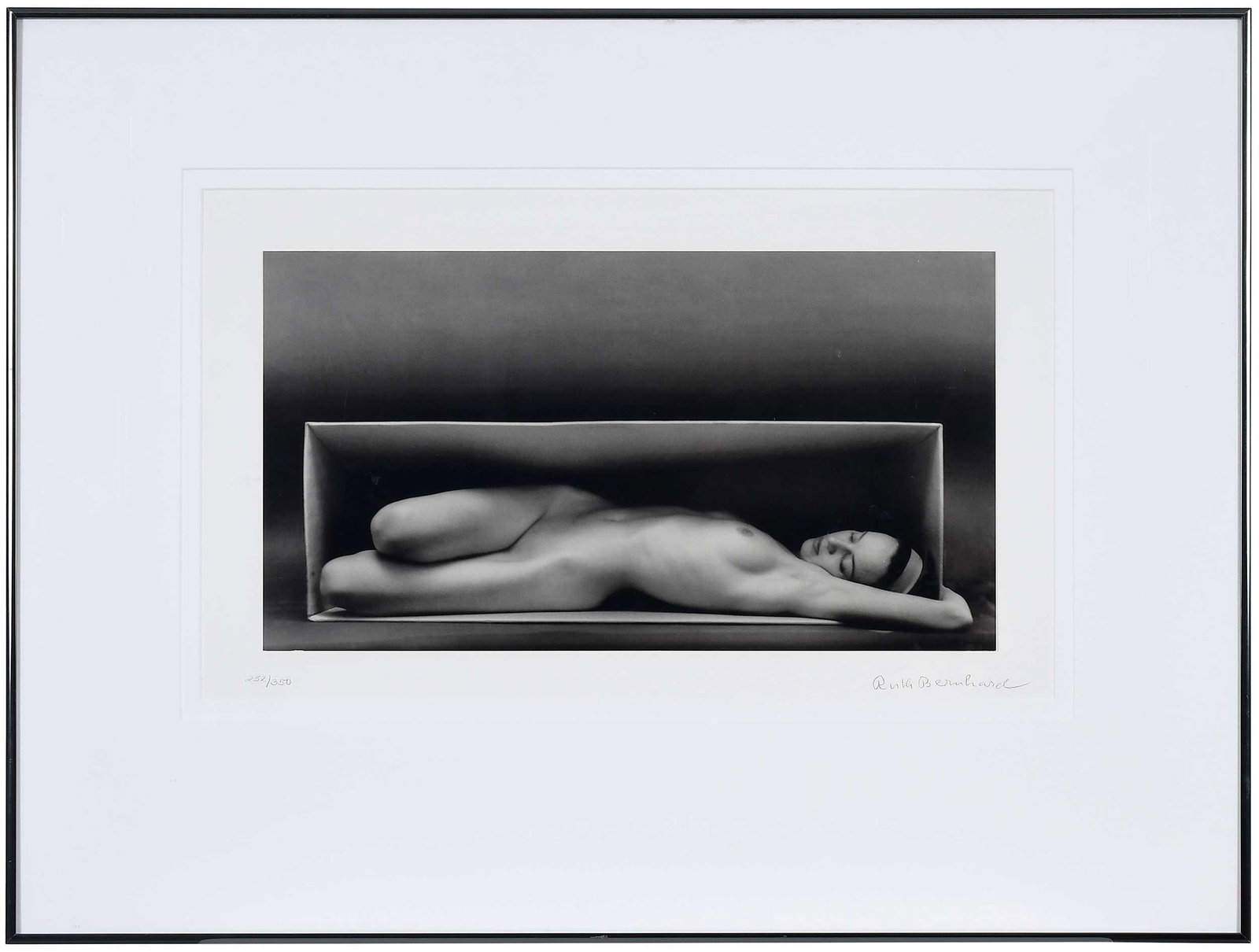 Ruth Bernhard: (German/America, 1905-2006)Nude In the Box, Horizontal, 1962, printed 1988, lithograph on heavy paper, signed lower right "Ruth Bernhard" in pencil, editioned 252/350 lower left, printed lower edge