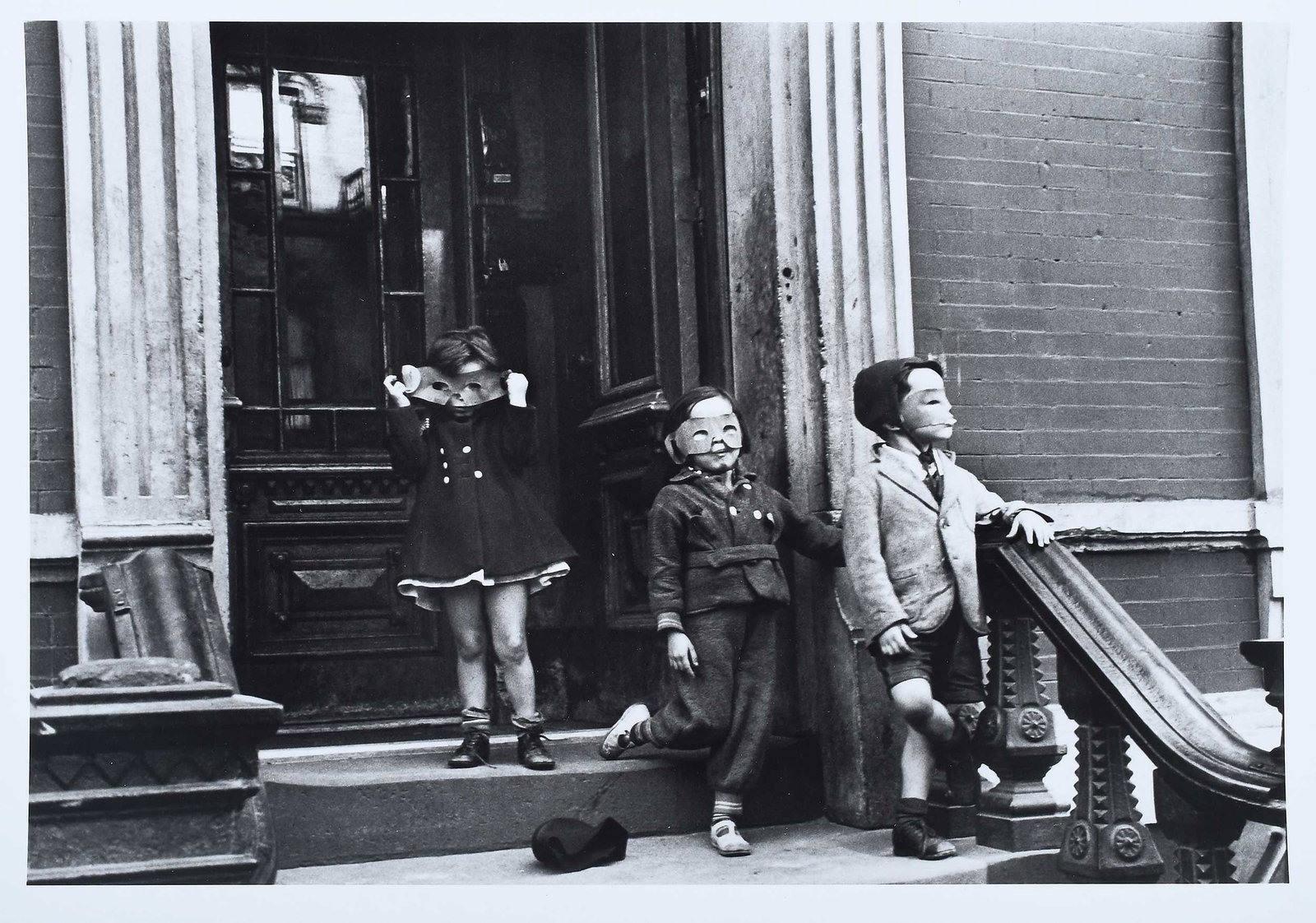 Helen Levitt: (American, 1913-2009)New York (Kids with Masks), from a 1940 image, unknown date of printing, possibly a press print (unknown edition) per label verso, image size 6-1/2 x 9-1/2 in., paper size 11 x
