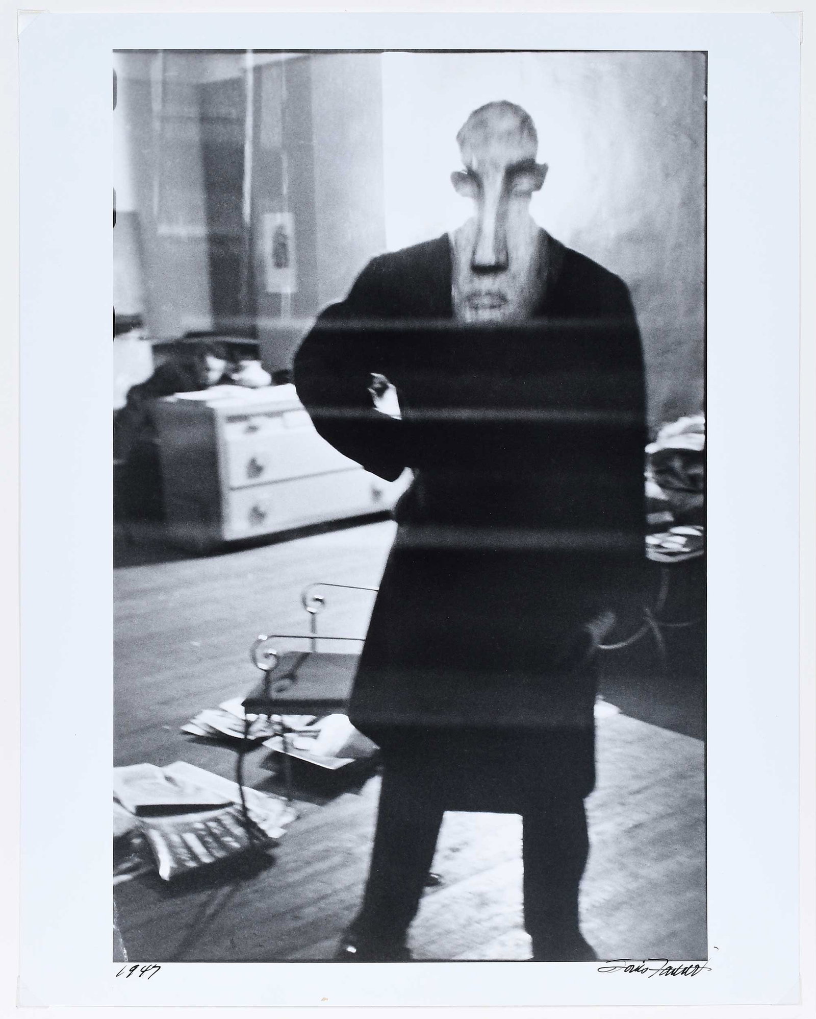 Louis Faurer: (American, 1916-2001) George Barrows in Robert Frank's Loft, New York, NY, 1947, printed 1991, image signed lower right "Louis Faurer", dated lower left, annotated with copyright and editioned 1/12 ve