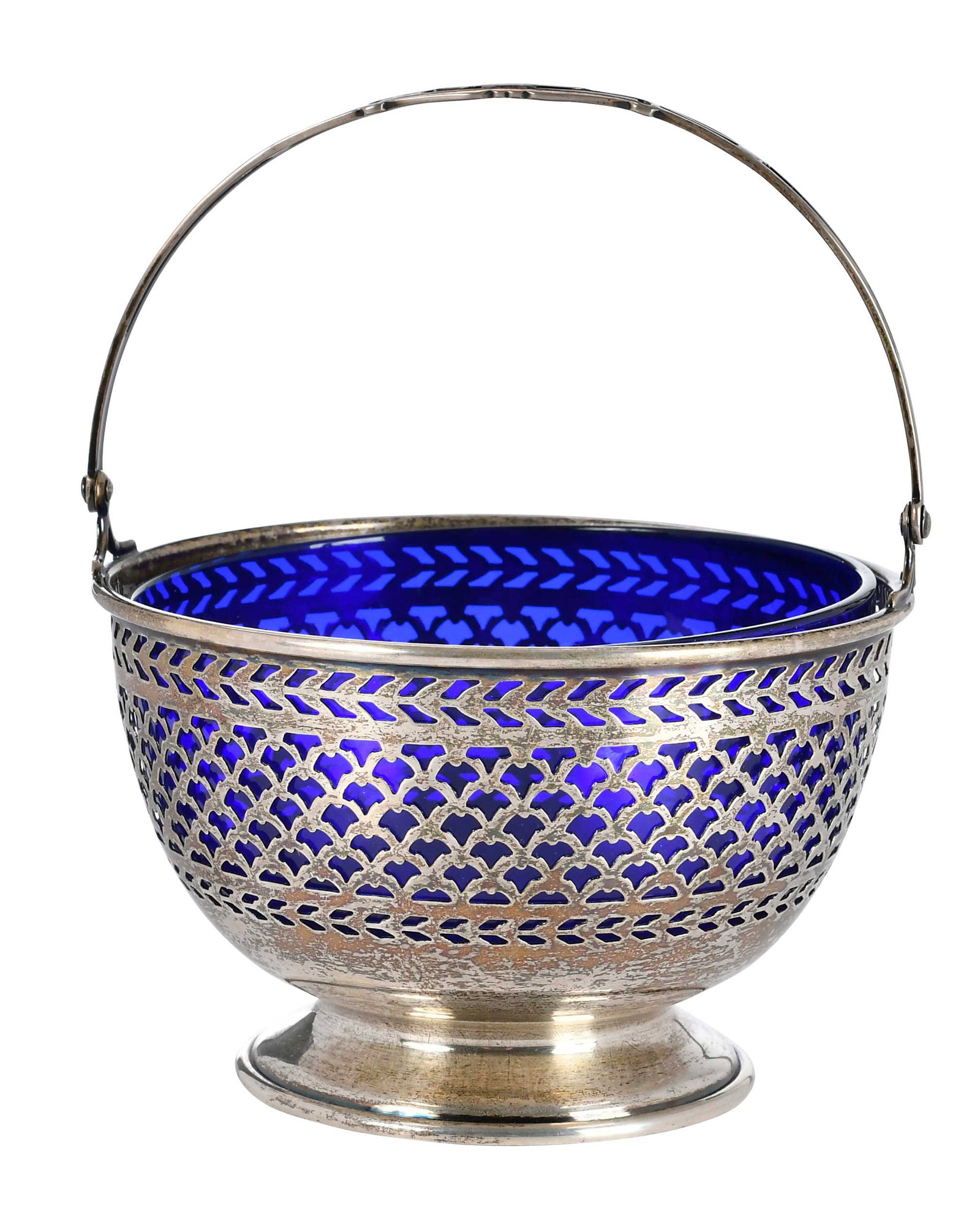 English Sterling Bowl with Blue Glass Liner: American, 20th century, round with bail handle, blue glass inset, marks for Watson, 3.15 oz. T. excluding glass, 5-1/2 x 4-3/4 x 4-1/4 in. Provenance: Private Virginia Collection
