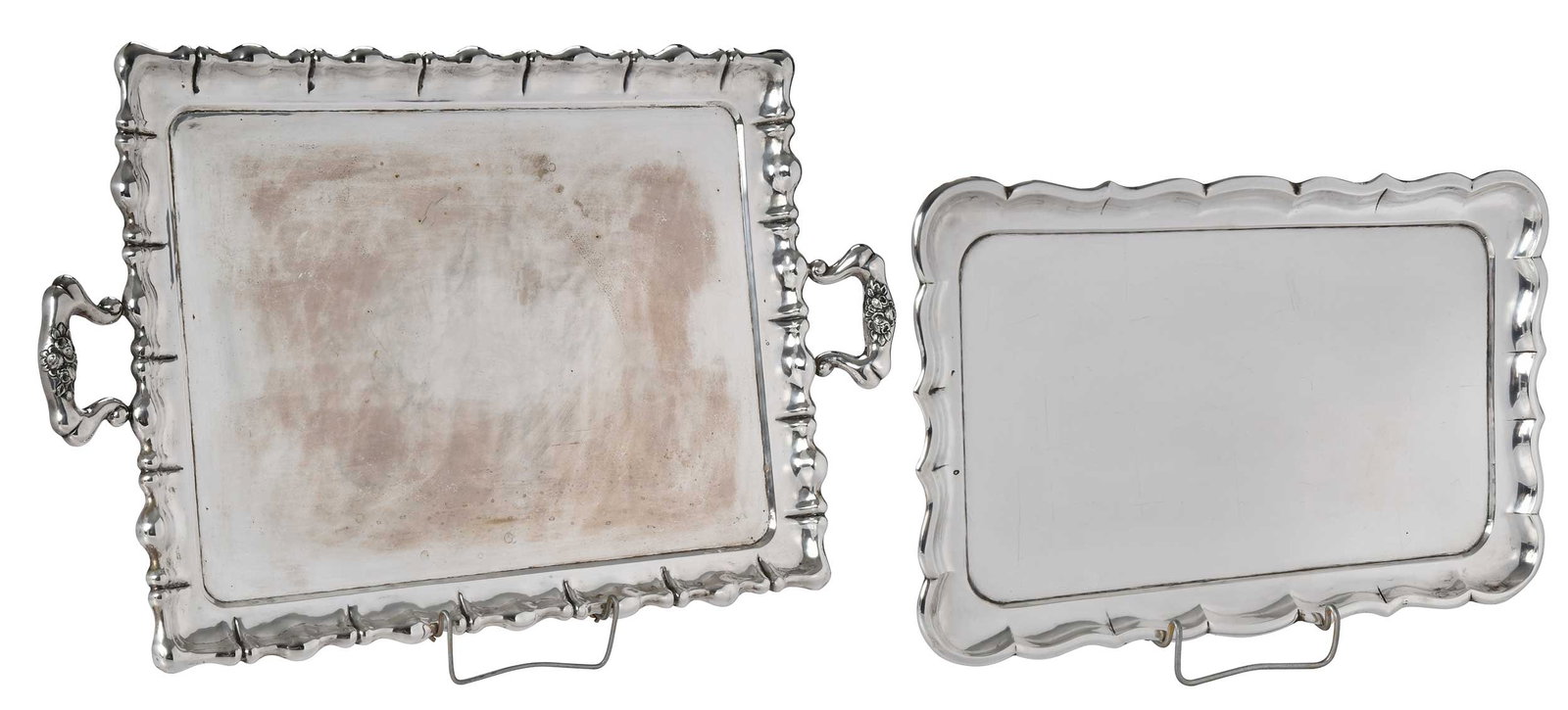 Two Hungarian Silver Trays: mid 20th century, both rectangular with scalloped borders, both with marks for Hungary, .800 fine, 101.40 oz. T., one 9-1/2 x 14-01/4 in.; one two handle, 26-3/4 x 17-1/4 in. Provenance: Private Ashev