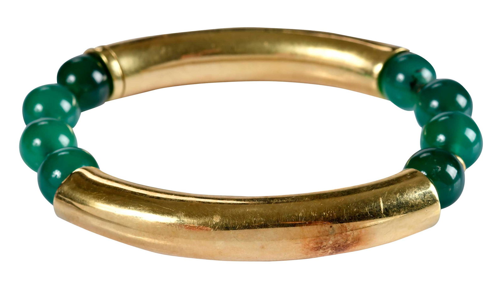18kt. Tiffany & Co. Chrysoprase Bead and Curved Link Bracelet: eight round beads, approx. 9.0 - 9.5mm, alternating two links, marked "TIFFANY, 18K", yellow gold, 6 in. inside measurement, hidden clasp, 26.5 g Provenance: Private collection Note: Brunk Auctions ma