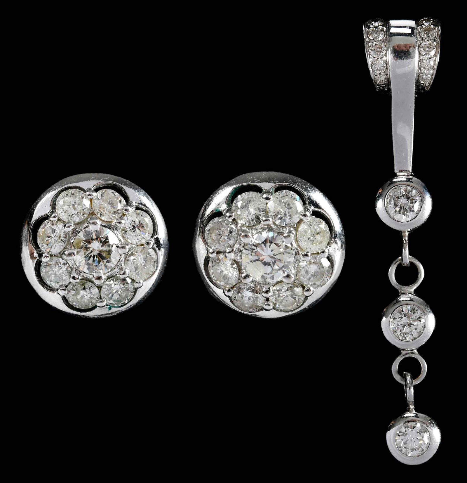 14kt. Diamond Drop Pendant and Diamond Button Earrings: three bezel set round faceted diamonds, approx. 1.40ctw., accented 12 round faceted diamonds, marked "14K", white gold, 2-3/8 in. length, 8.9 g; 18 round faceted diamonds, approx. 2.75ctw., SI-I, G-H,