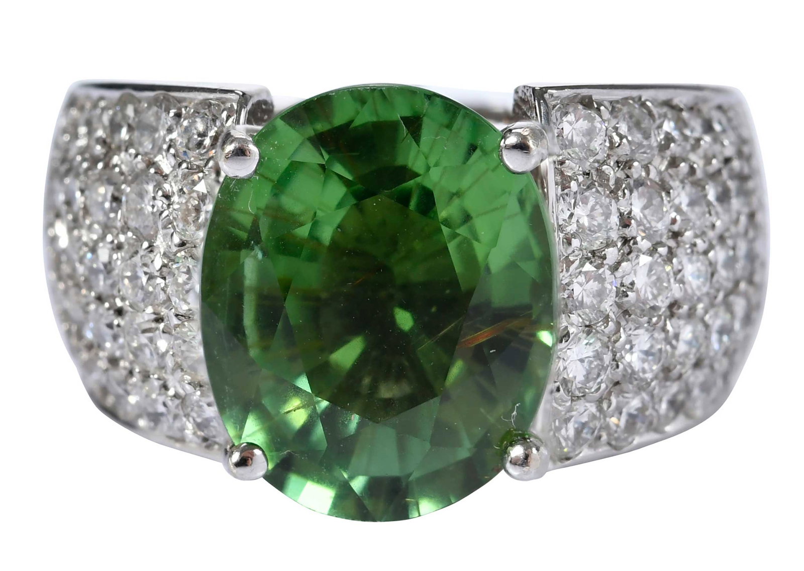 14kt. Rare Green Tourmaline and Diamond Accented Ring: oval mixed faceted cut green tourmaline, approx. 6.25ct., 60 round faceted diamonds, graduating in size, approx. 1.75ctw., marked "14k", white gold, 9 ring sz., 14.4 g Provenance: Private Collection, 
