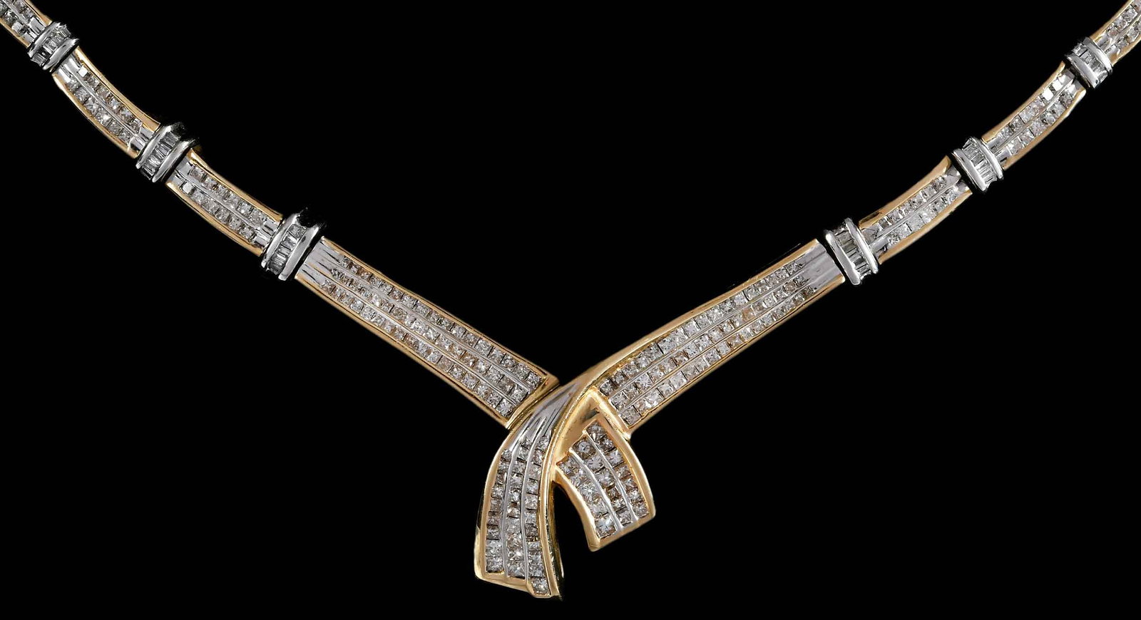 14kt. Diamond Accented Two Tone Fashion Necklace: channel set, princess cut diamonds, graduating in size, alternating links of straight baguette cut diamonds, approx. 5.75ctw., SI-I, H-J, marked "14K", white and yellow gold, 16 in. length, 36.1 g Pro