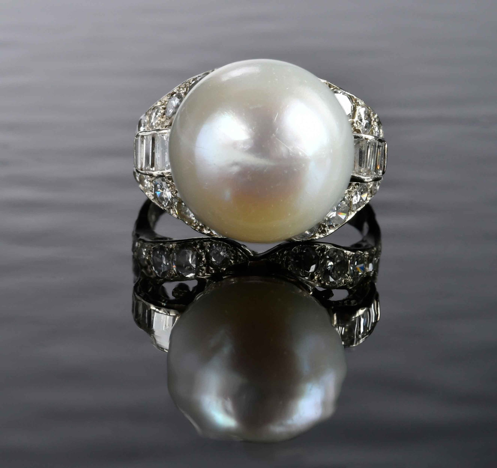 14kt. Vintage Style Cultured South Sea Pearl and Diamond Ring: drop shape white pearl, approx. 14.0mm, six straight baguette cut diamonds, 20 round faceted diamonds, approx. 1.60ctw., marked "14k", white gold, 9 ring sz., 11.3 g Provenance: Private Collection, Vi