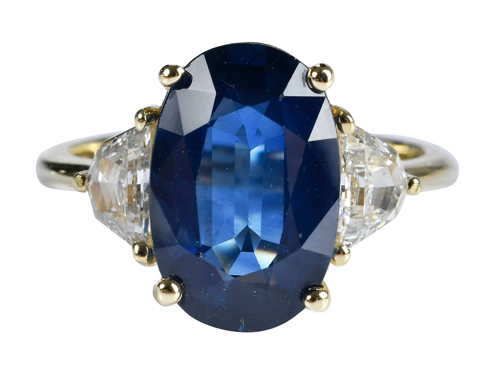 18kt. Blue Sapphire and Diamond Ring - GIA: oval faceted blue sapphire, 5.31ct., GIA # 1232886613, two modified step cut diamonds, approx. 0.60ctw., VS, G-H. marked "18K", yellow gold, 7-1/2 ring sz., 5.3 g Provenance: Private Collection Note: 