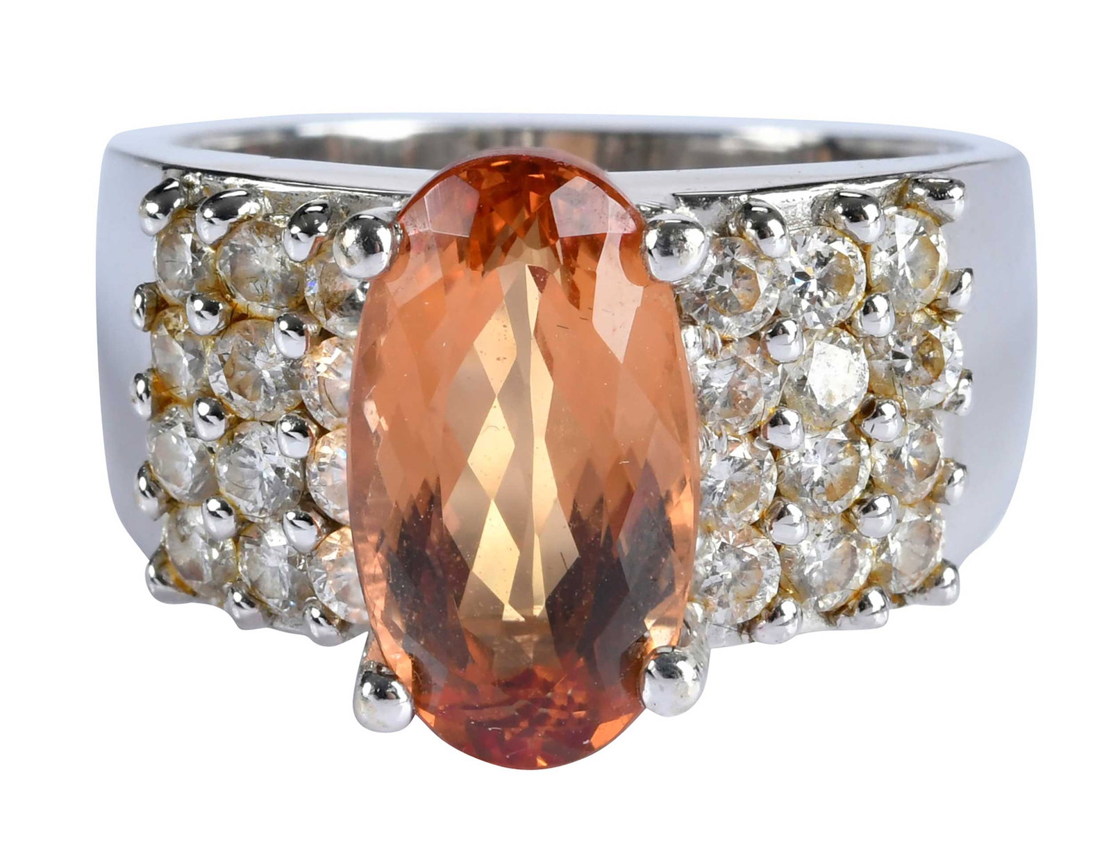 18kt. Imperial Topaz Diamond Ring: oval Portuguese cut imperial topaz , approx.4.60ct., 24 round faceted diamonds, approx. 1.15ctw., marked "18K", white gold, 8-1/4 ring sz., 12.1 g Provenance: Private Collection, Virginia Beach Note: 