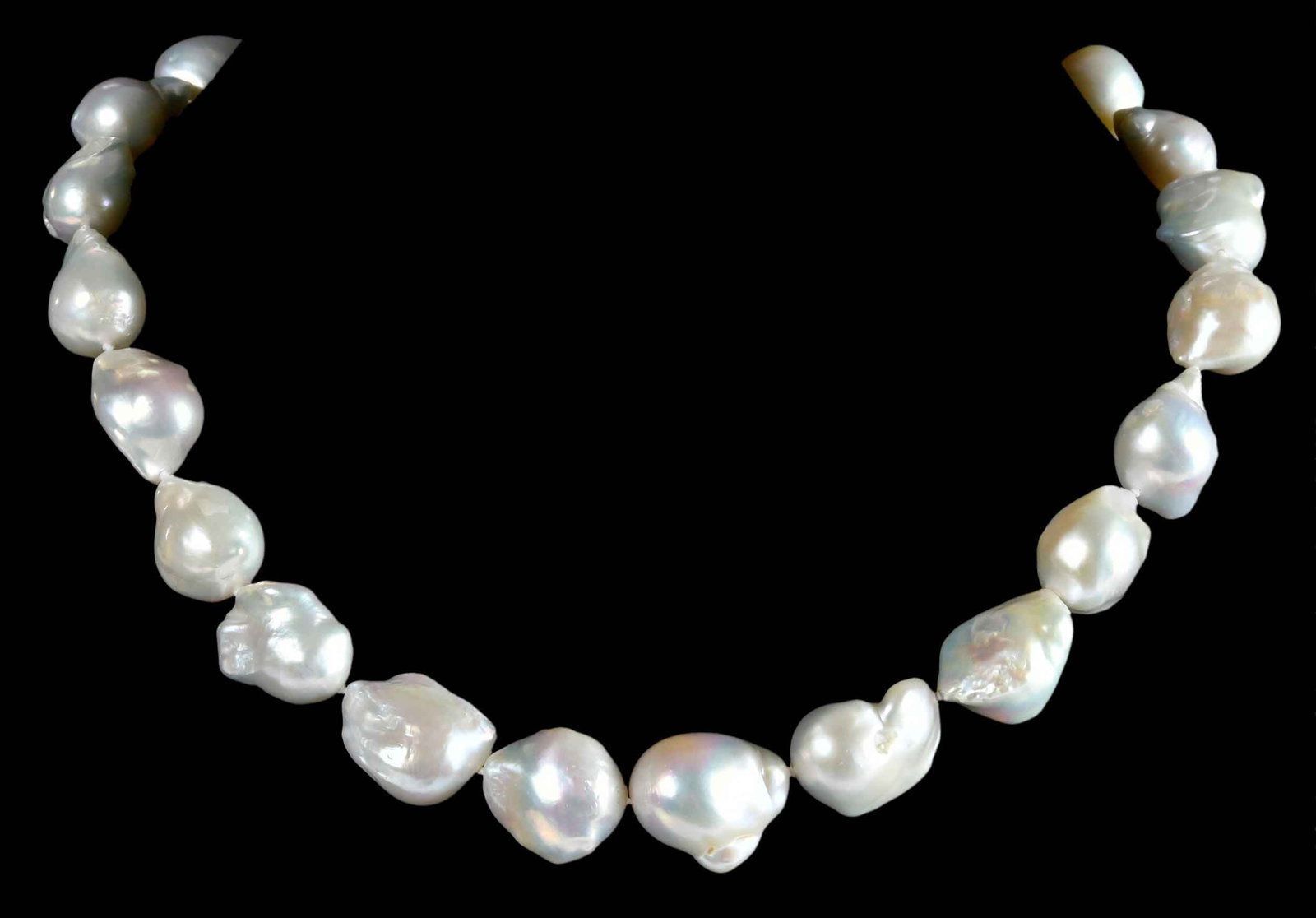 Sterling Silver Single Strand of White Baroque Pearls: 23 baroque pearls, graduating in size, approx. 13.0 - 14.5mm, marked "925", sterling silver, 18 in. length, clasp has clear jewel, 107.2 g Provenance: Private Collection, Virginia Beach Note: Brunk Au